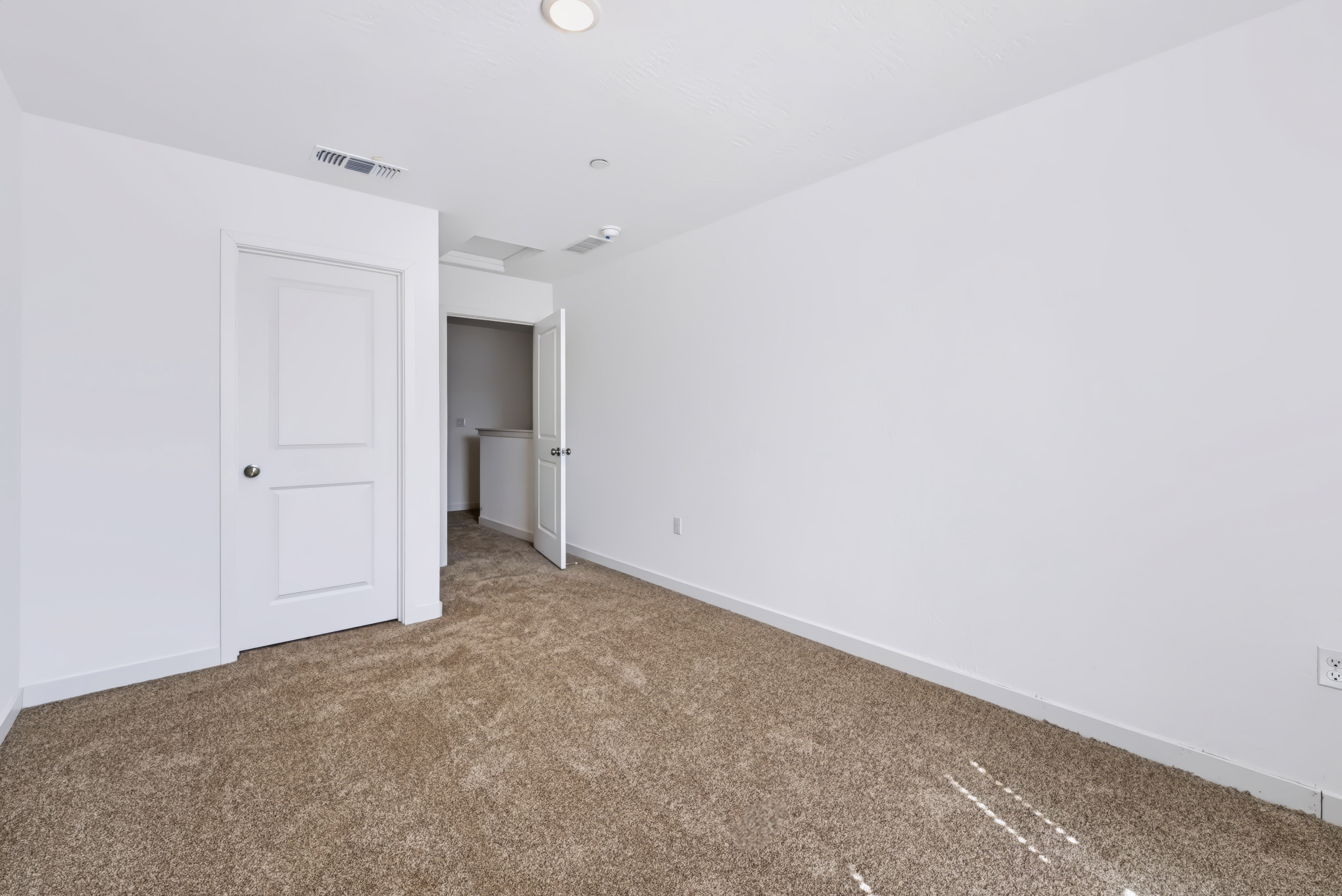 A room with white doors.