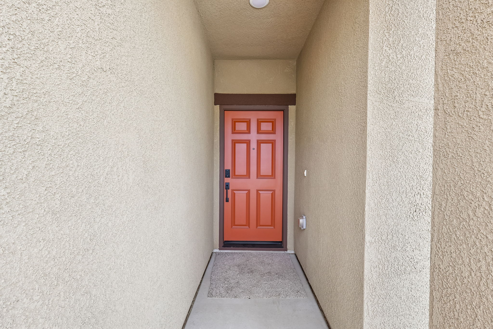A red door in a hallway.