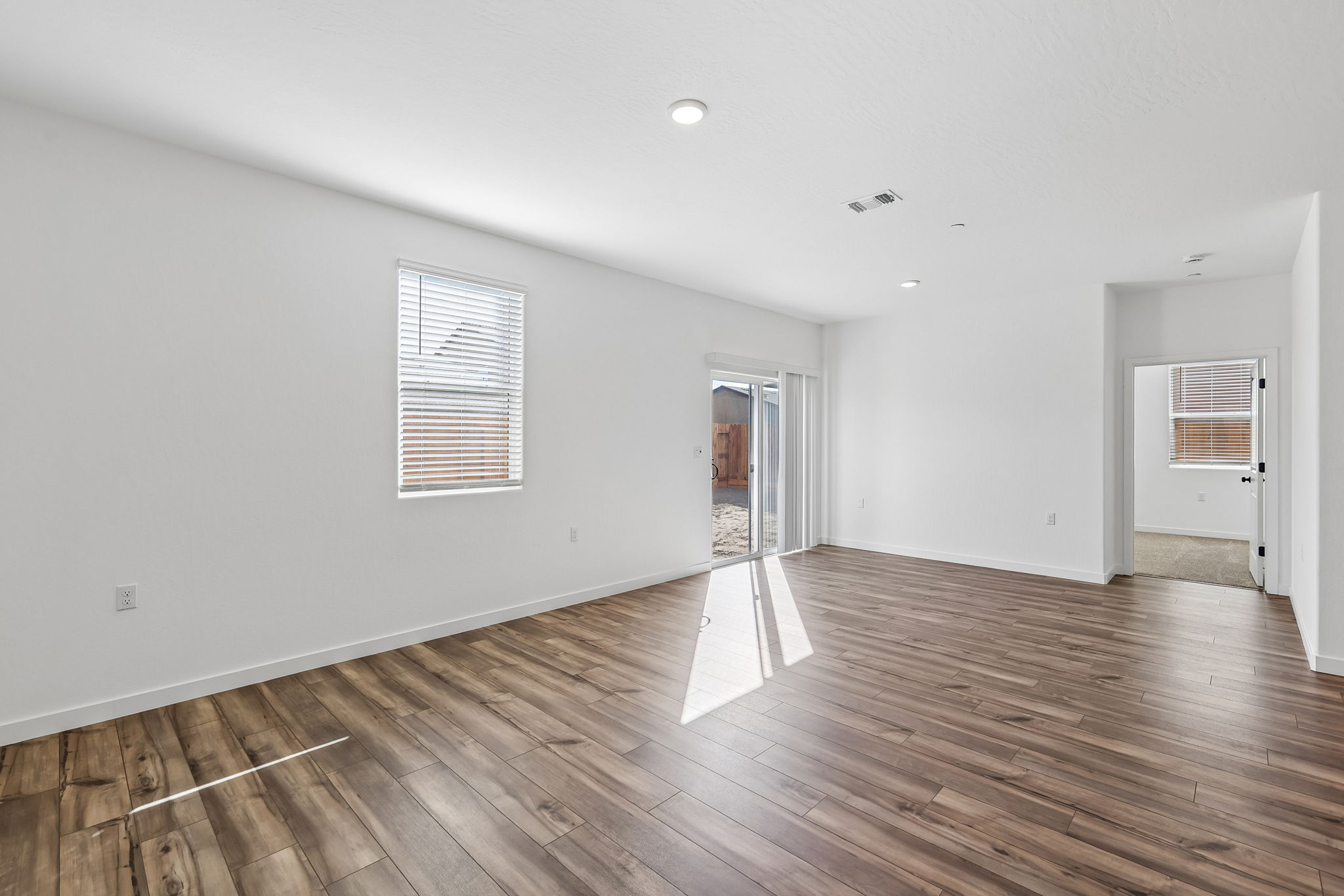 A room with a wood floor and a wood floor.