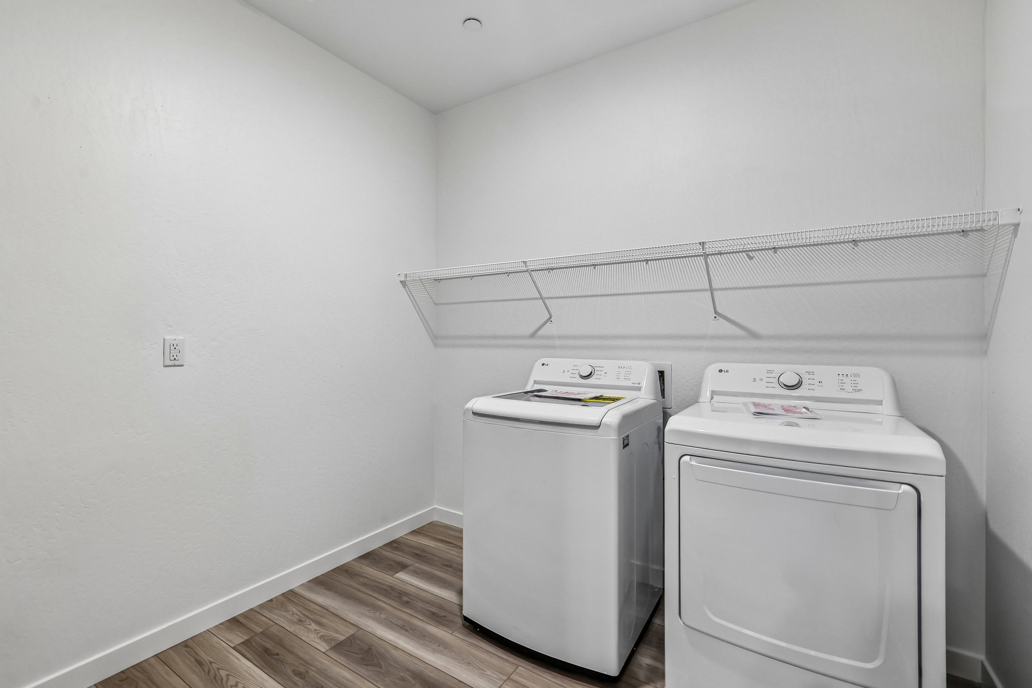 A washing machine in a room.