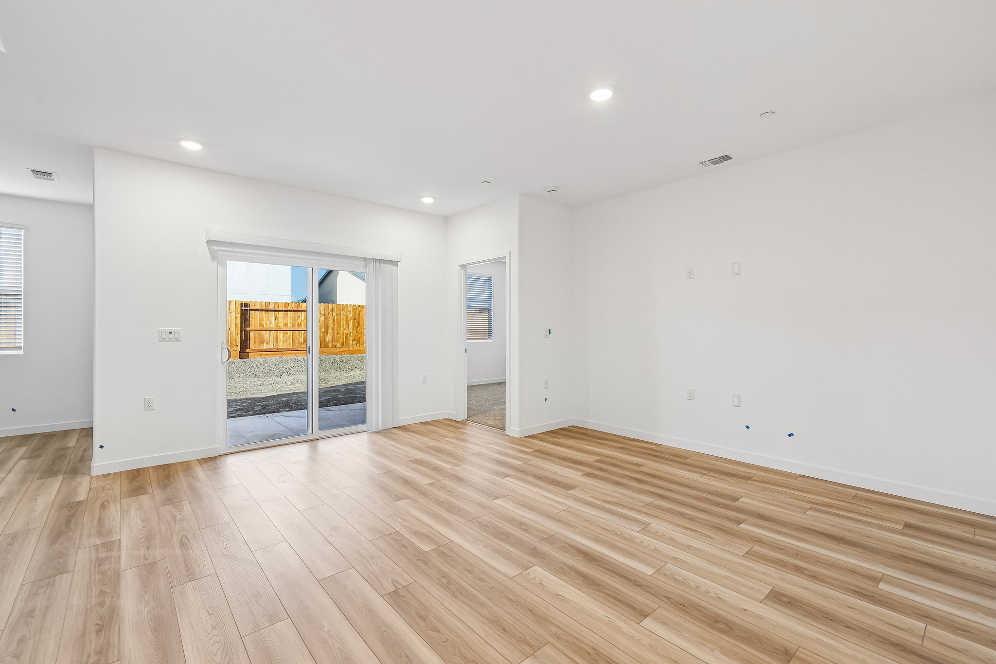 A room with a wood floor and a wood floor.