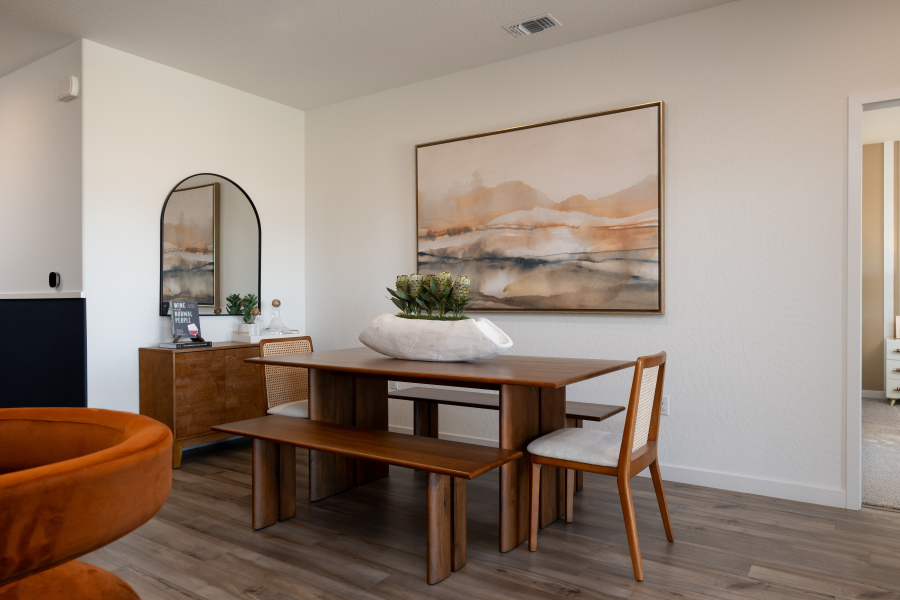 A room with a table and chairs.