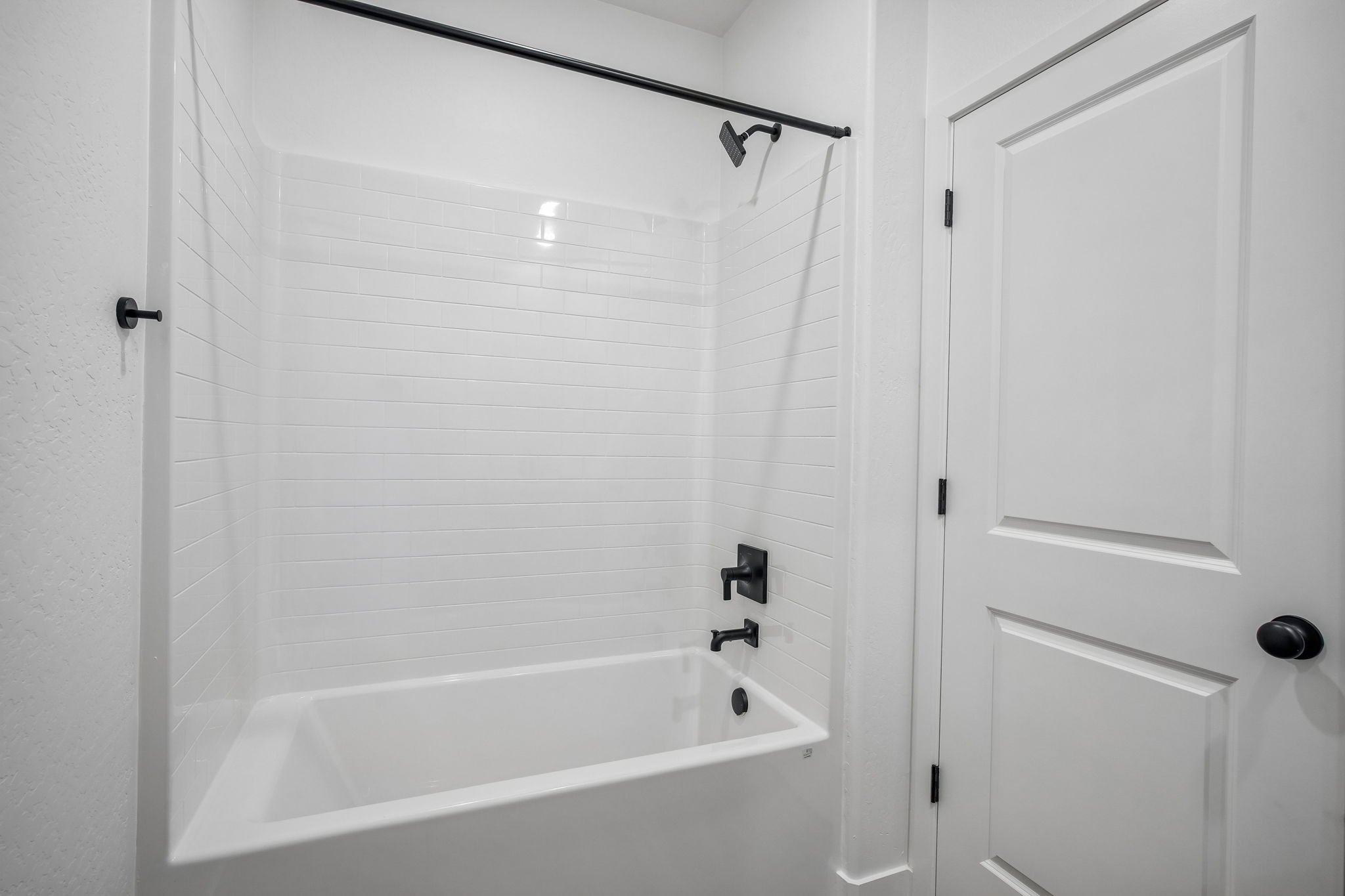 A bathtub in a bathroom.