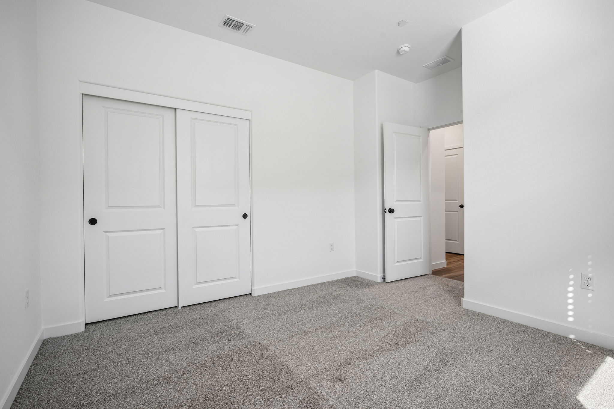 A room with white doors.