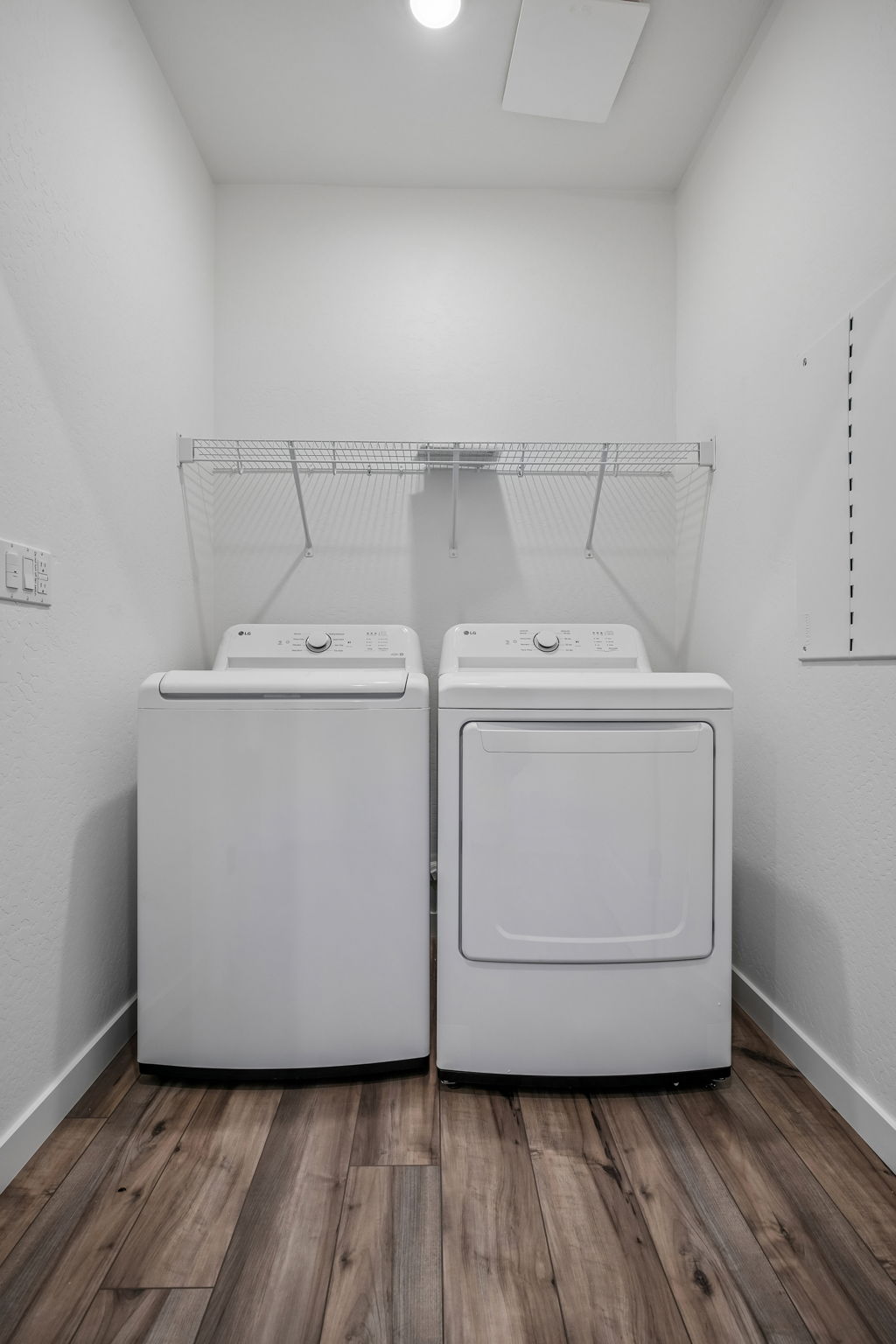 A washing machine in a room.