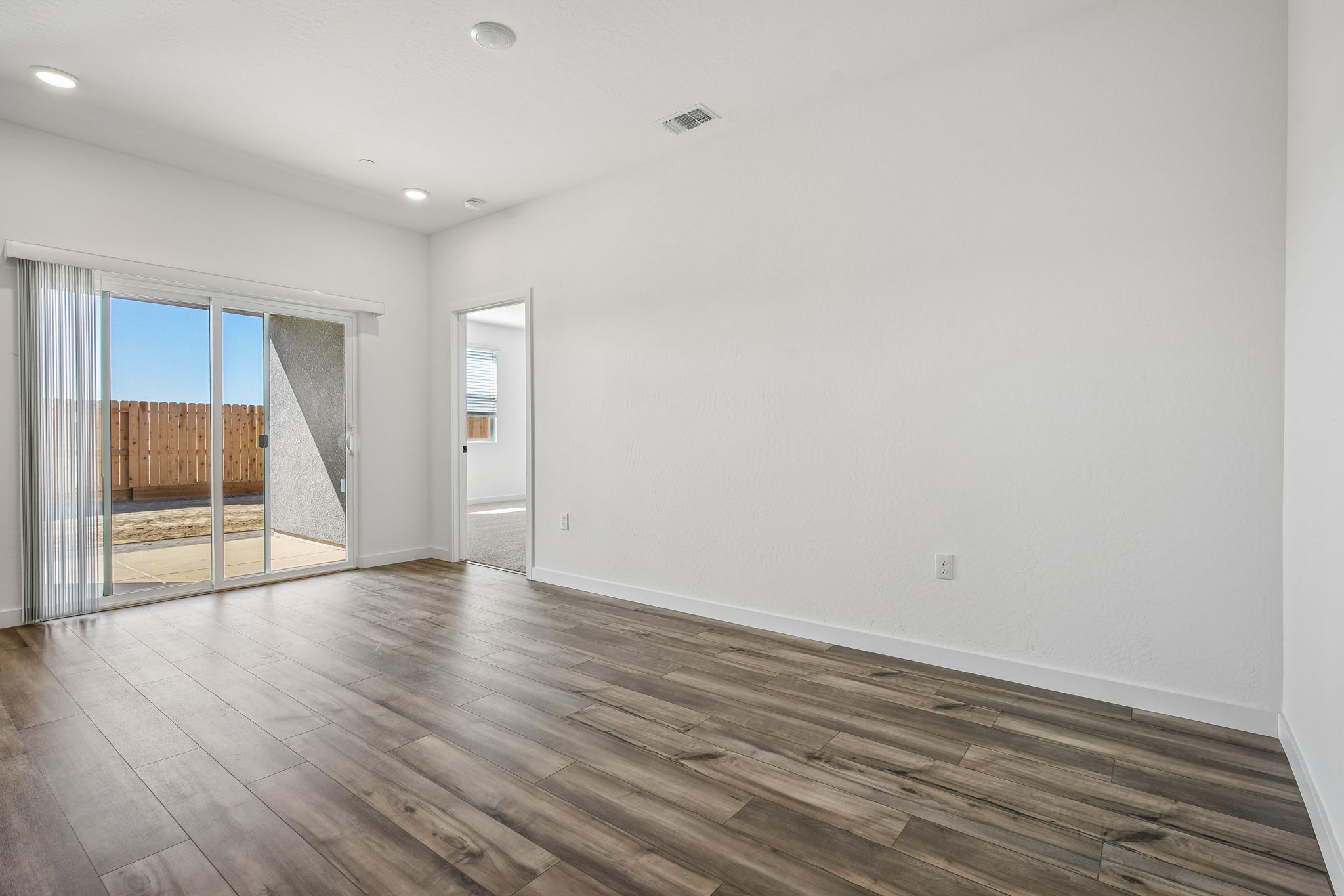 A room with a wood floor and a wood floor.