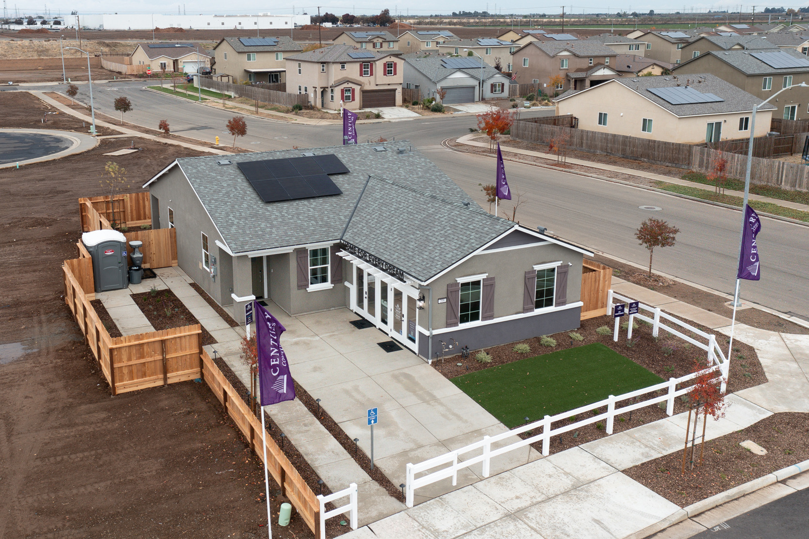 A house with a pool and a fence around it.