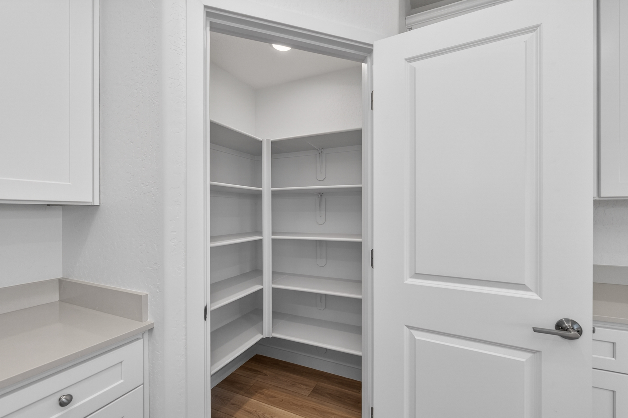 A white cabinet in a room.