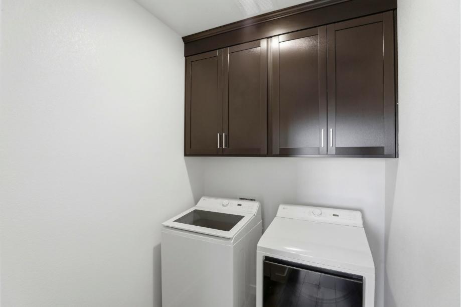 A kitchen with a stove and cabinets.
