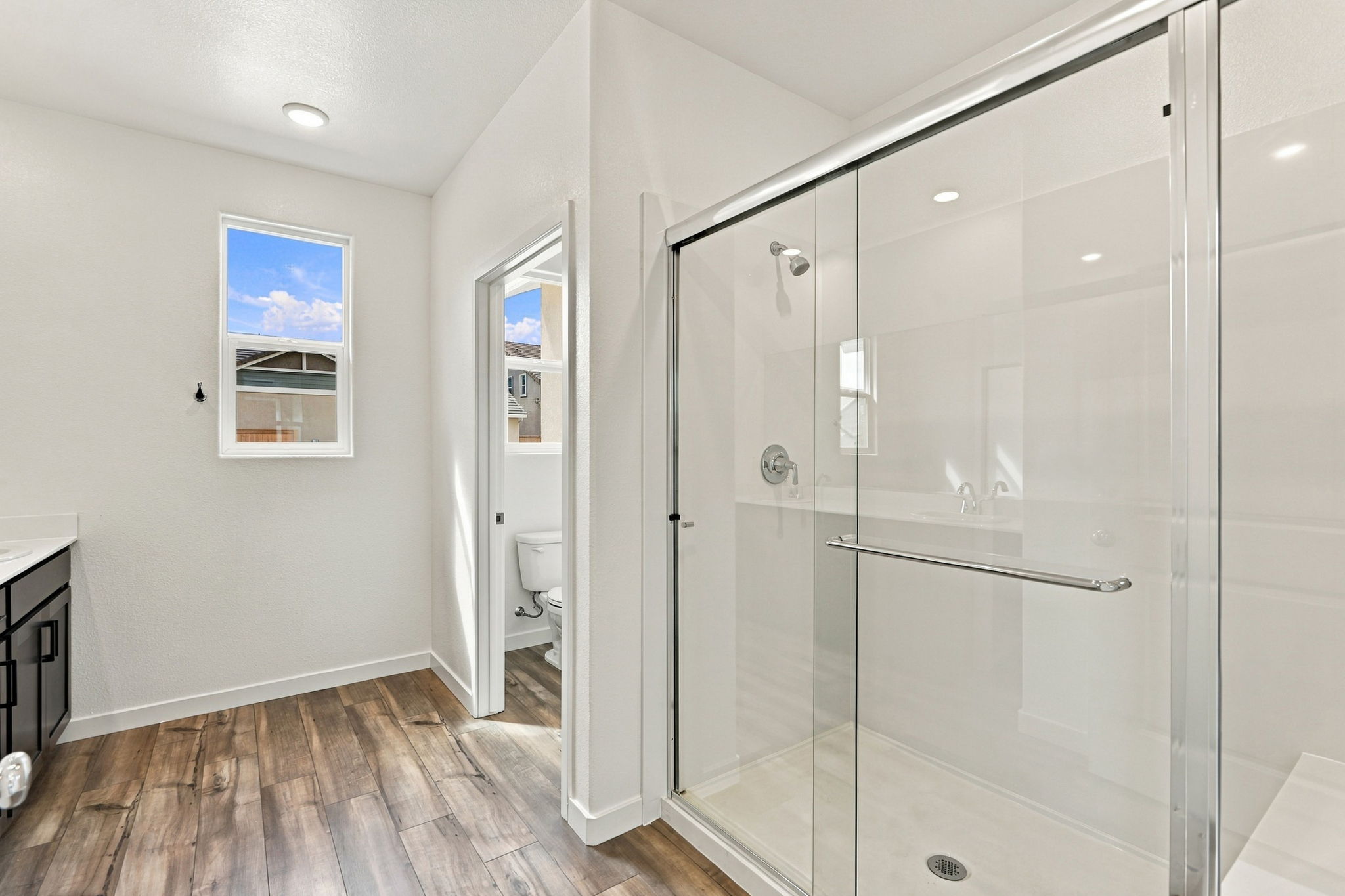 A bathroom with a glass shower.