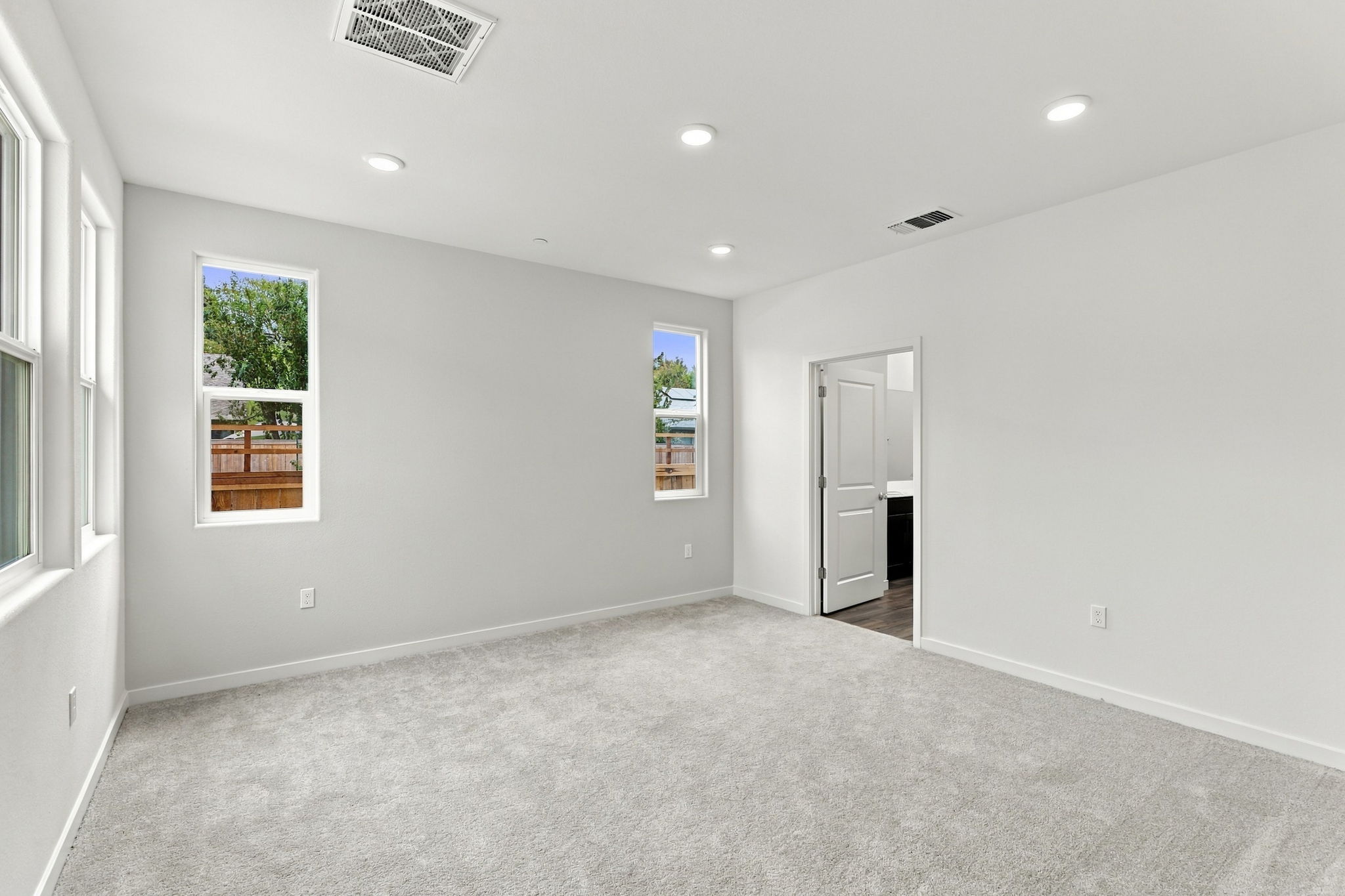 A room with a door and windows.