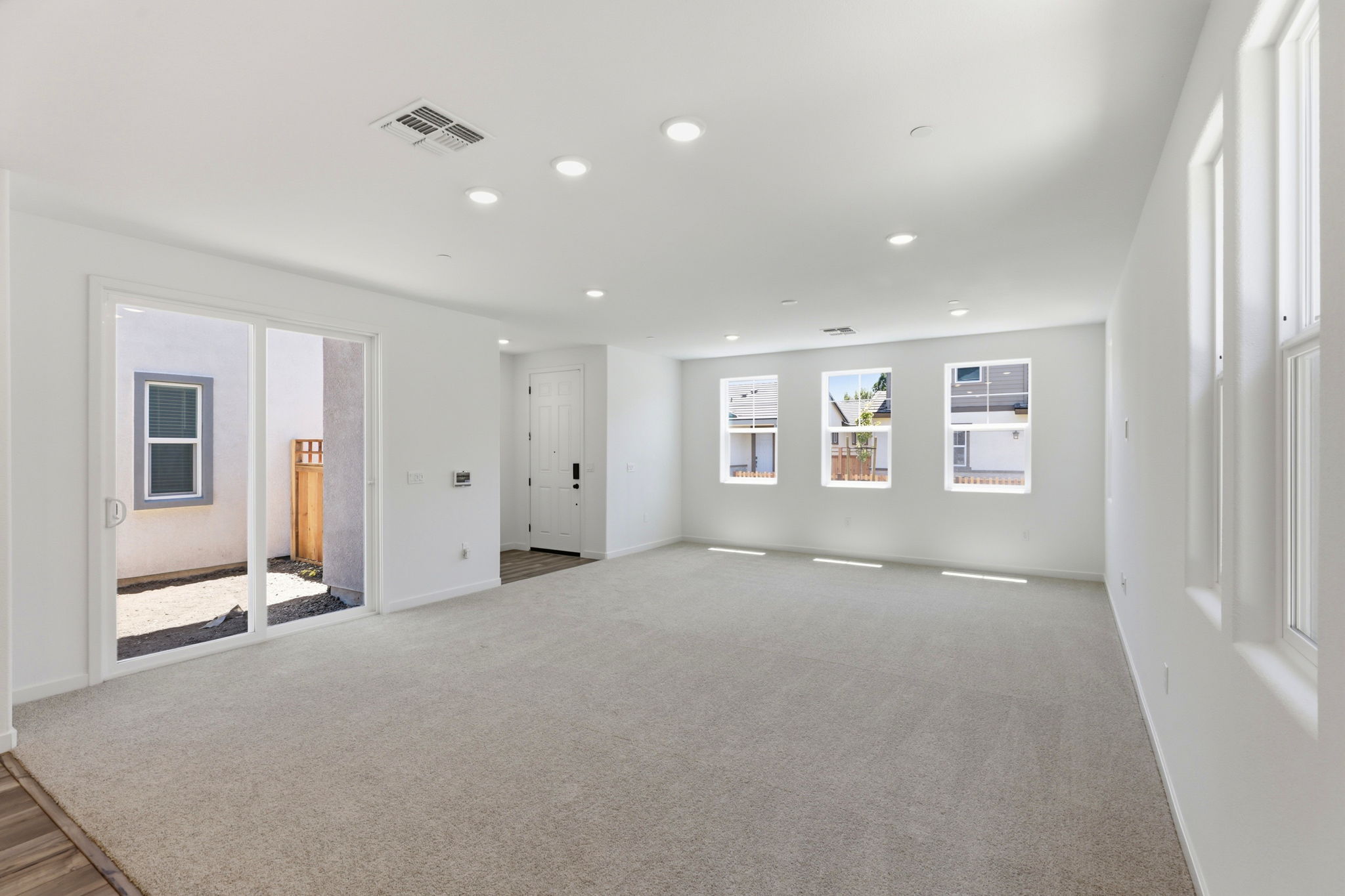 A long hallway with white walls.