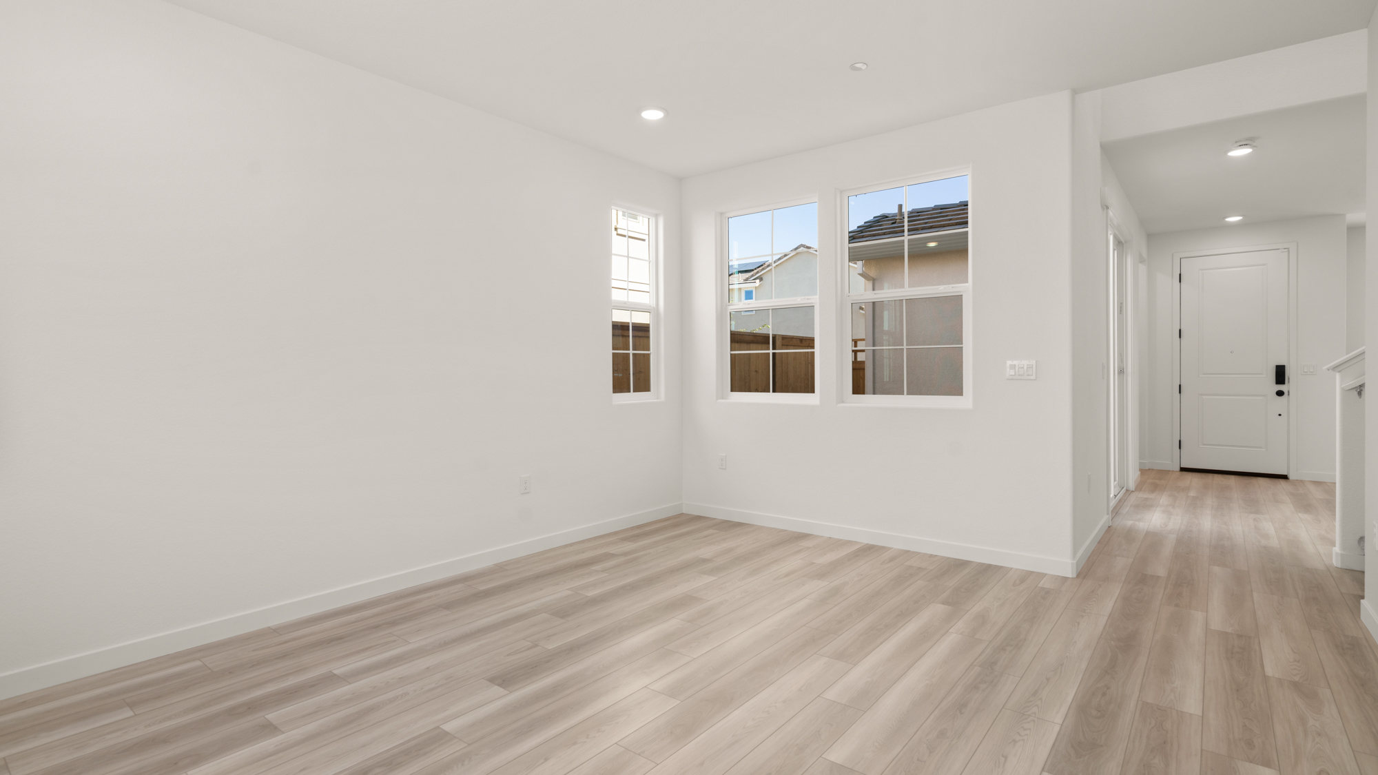 A room with white walls and windows.