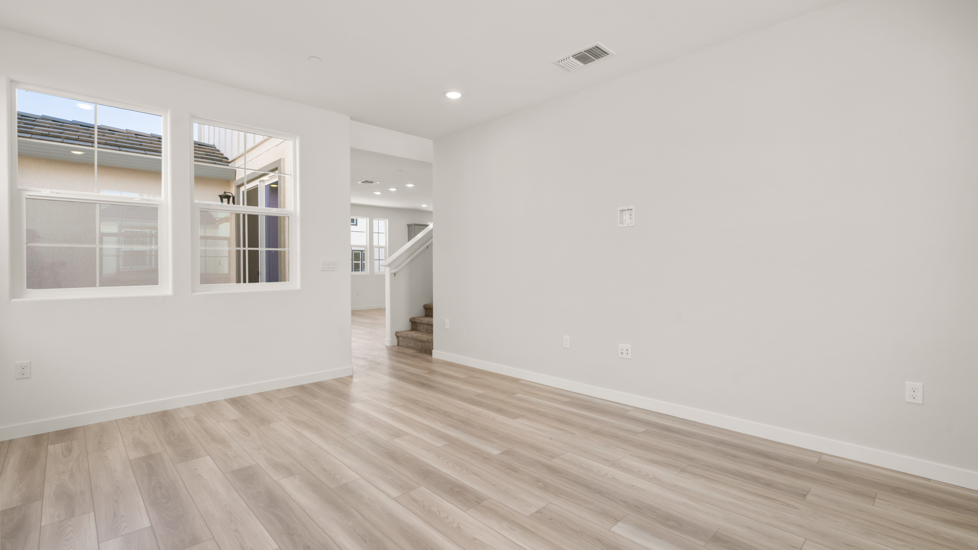 A room with a wood floor and a wood floor.