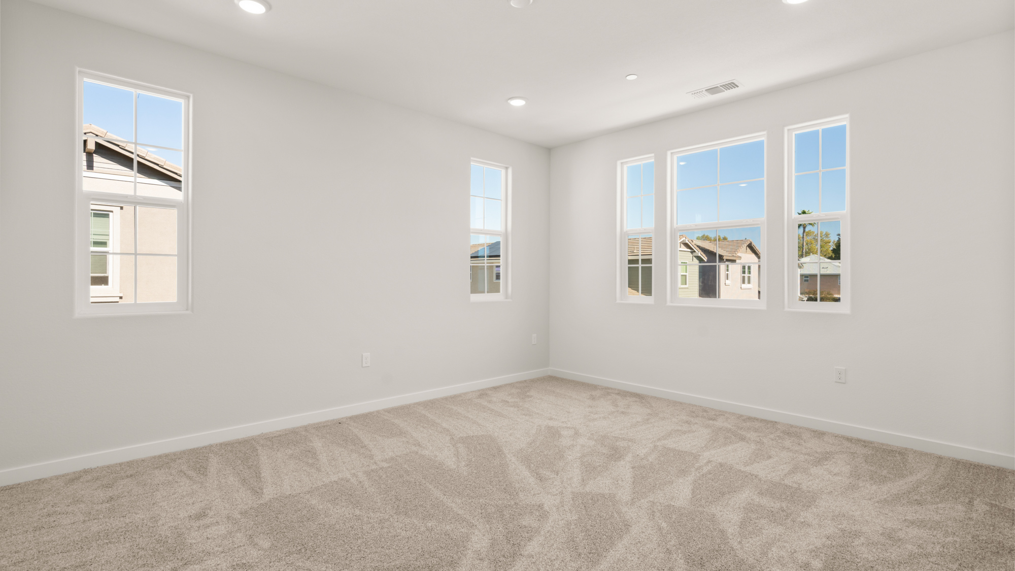 A room with white walls and windows.