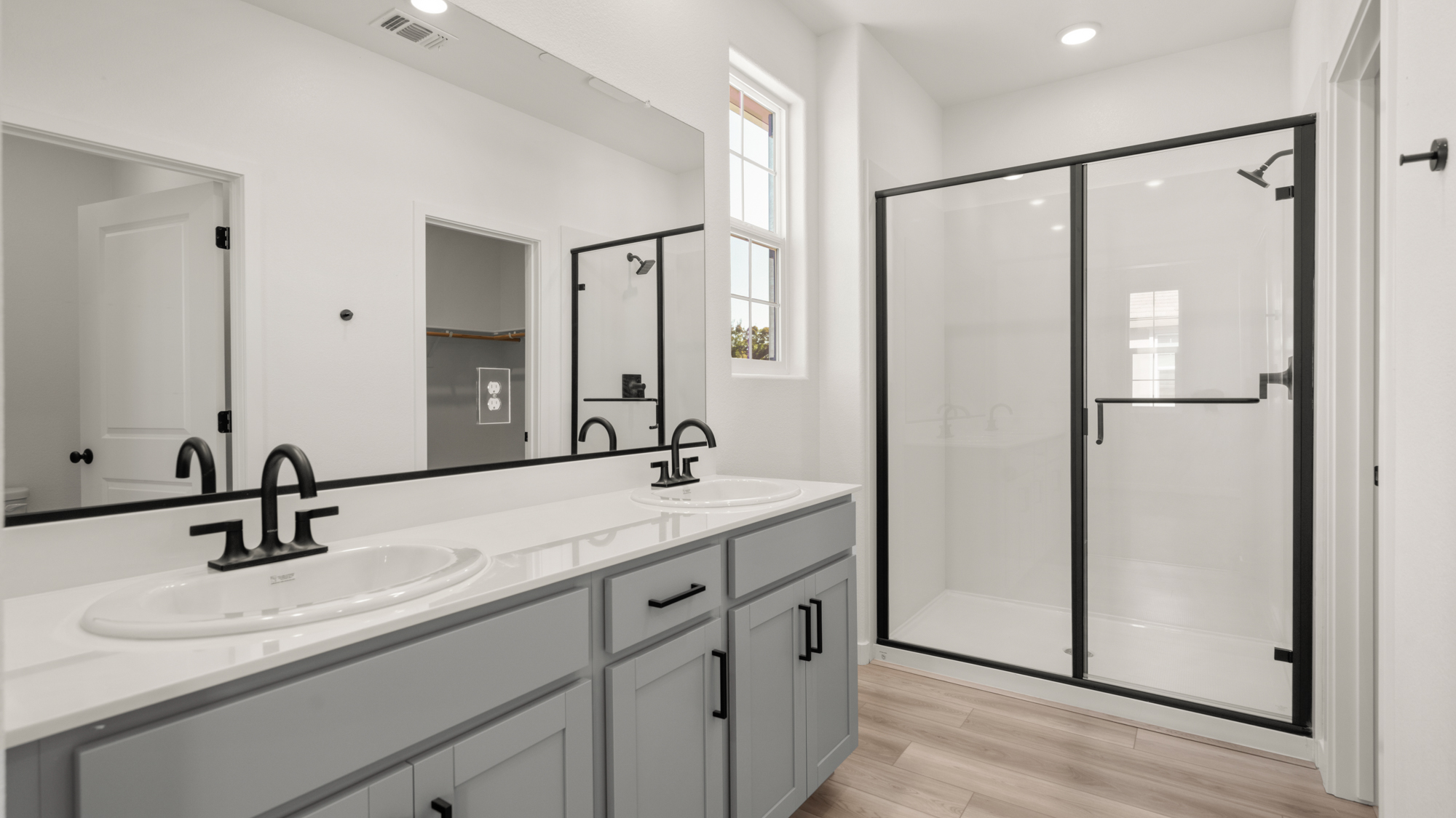 A bathroom with a glass shower.