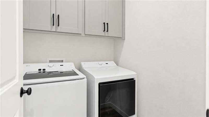 A white kitchen with white cabinets.