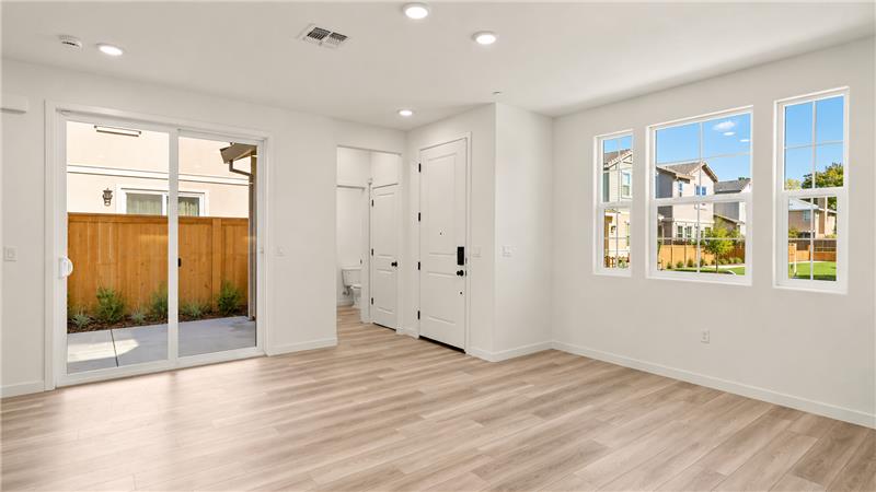 A room with white walls and windows.