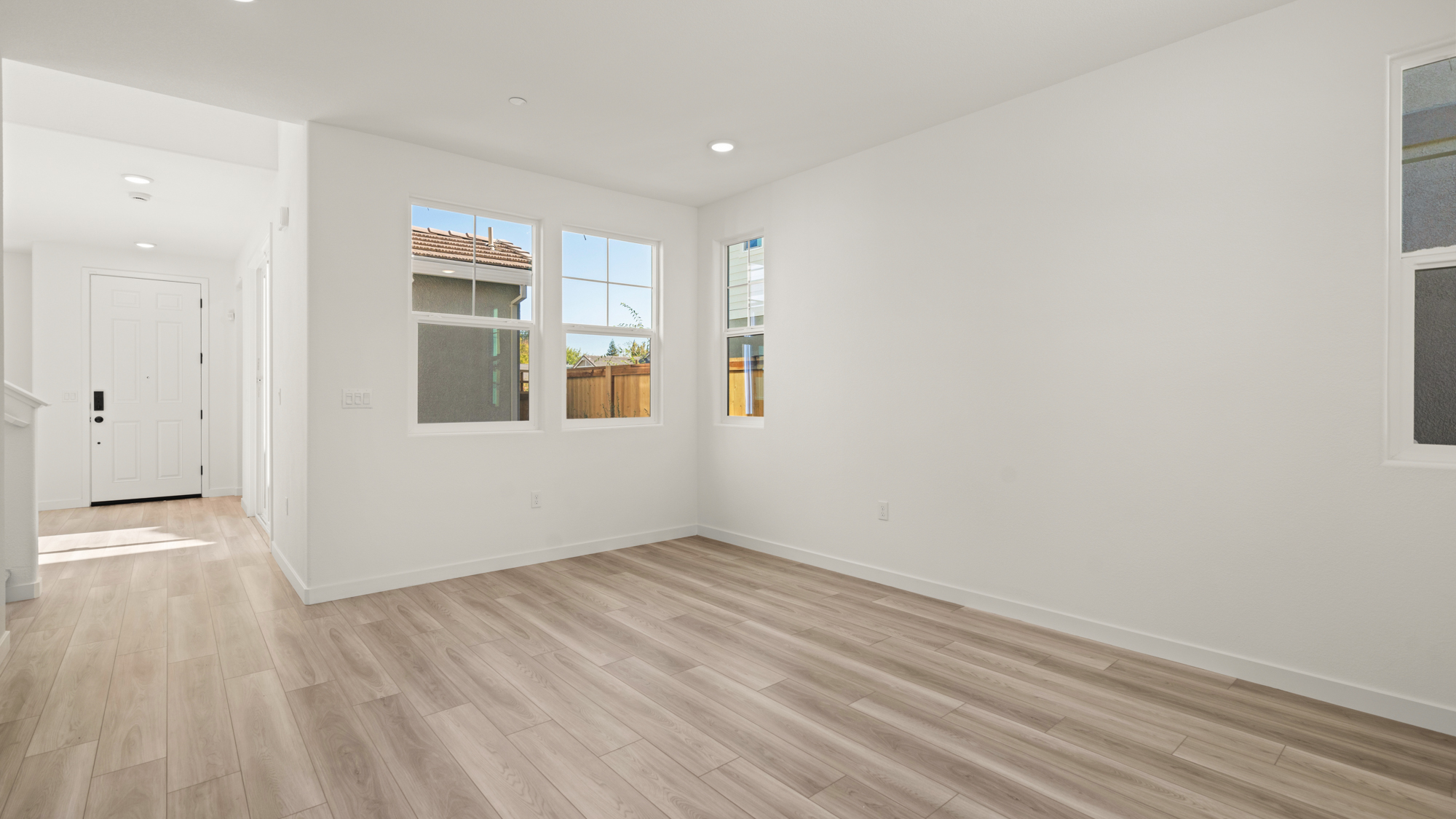 A room with white walls and windows.