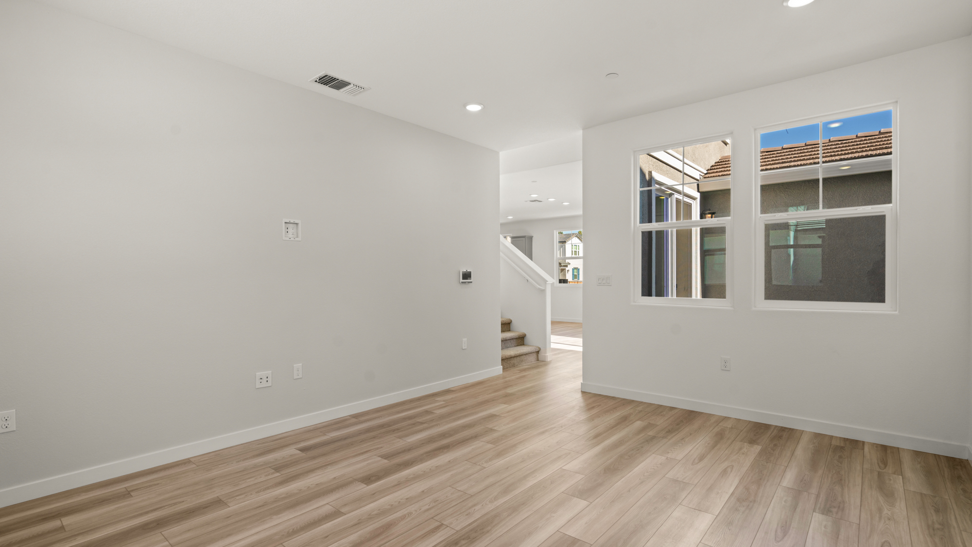 A room with a wood floor and a wood floor.