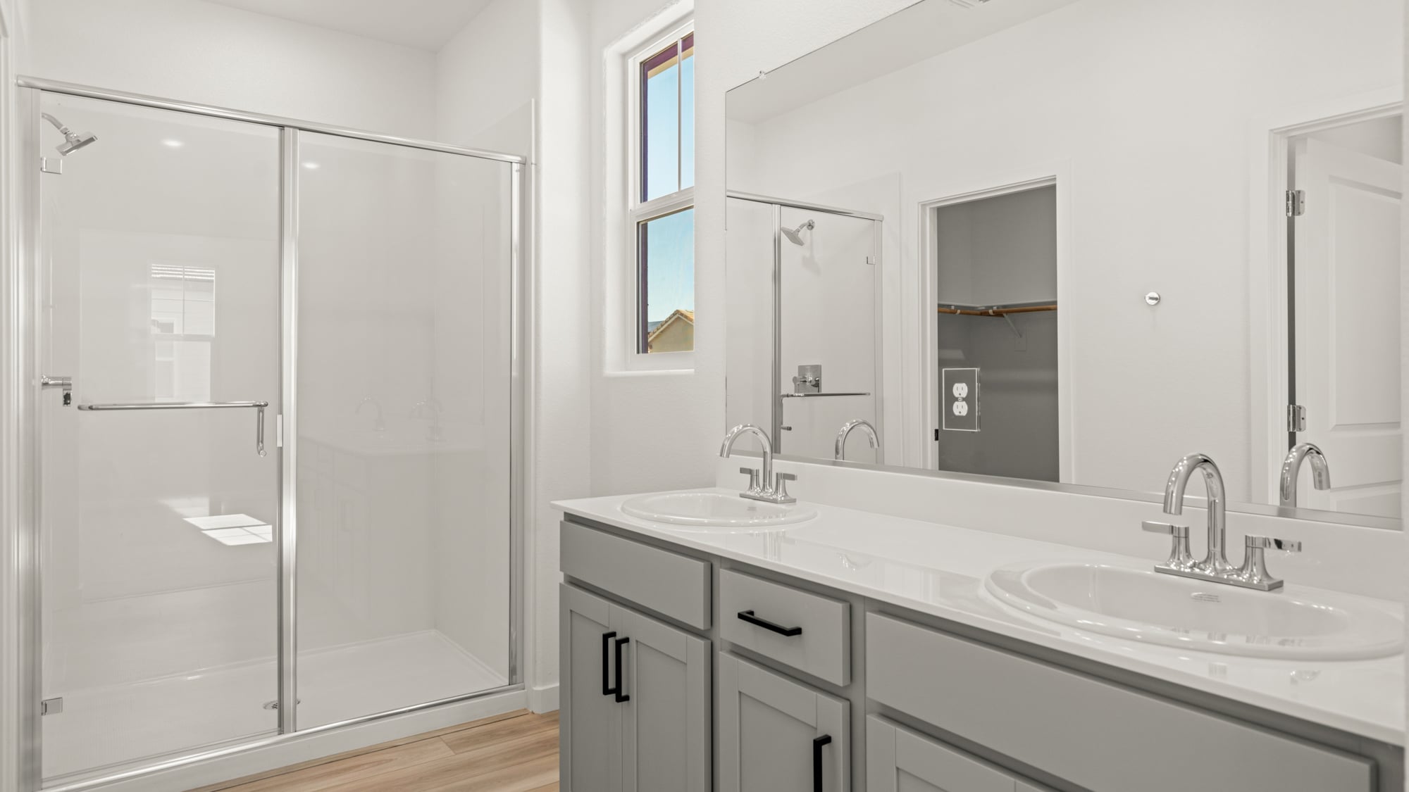 A bathroom with a glass shower.