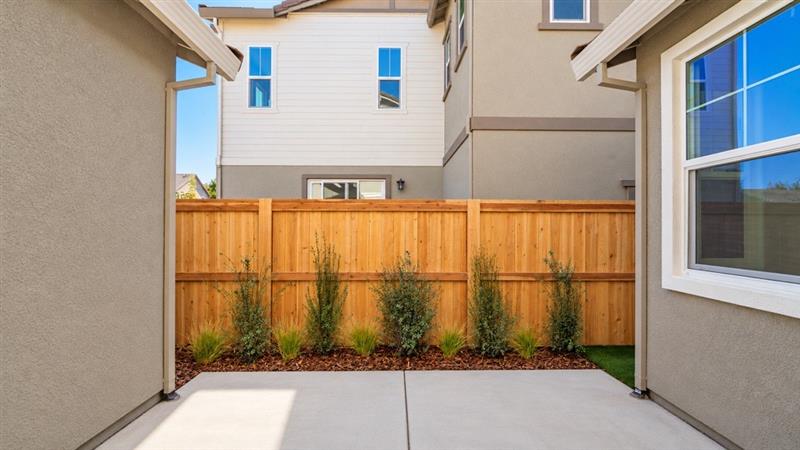 A fence in front of a house.