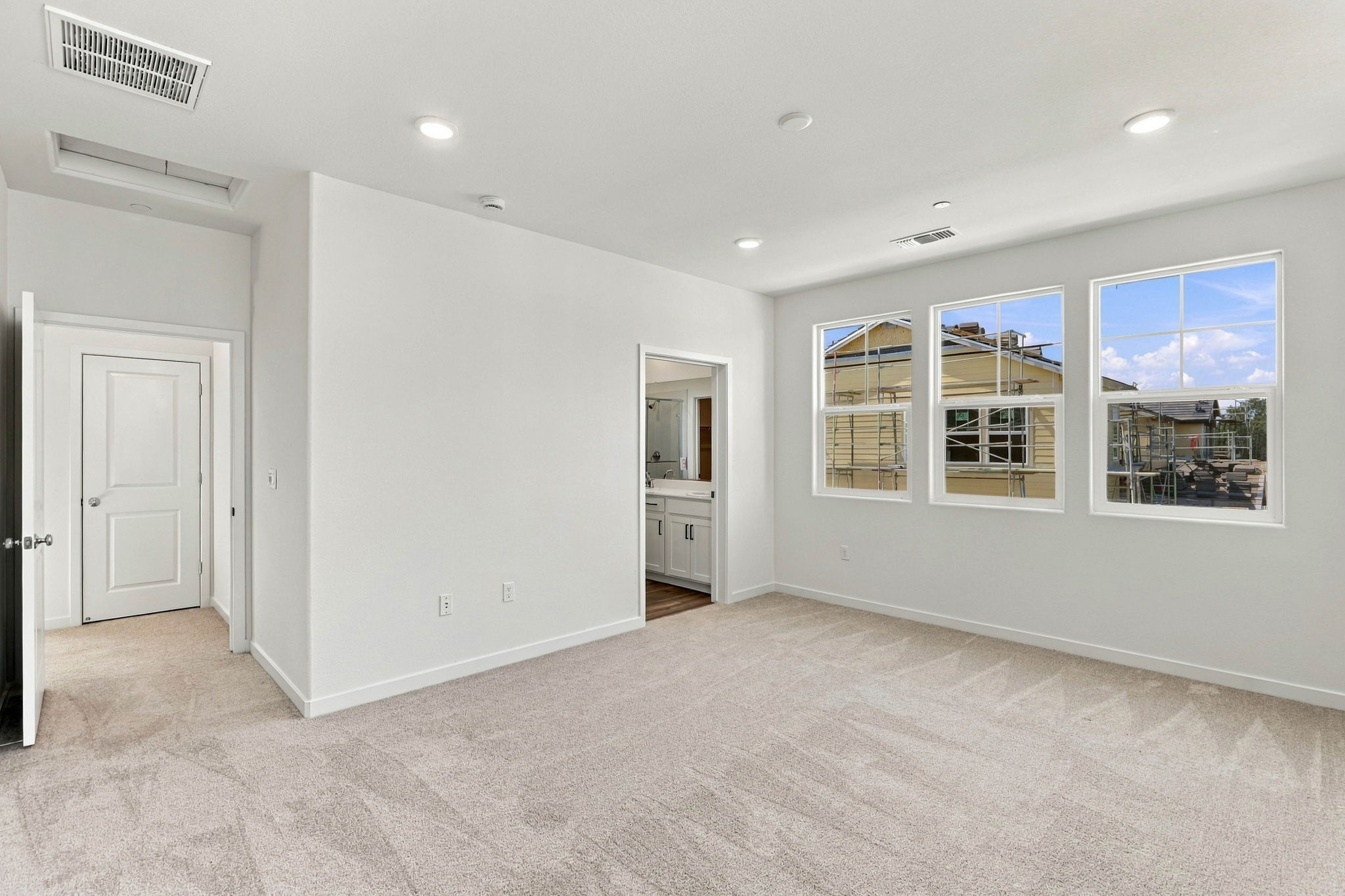 A room with white walls and windows.