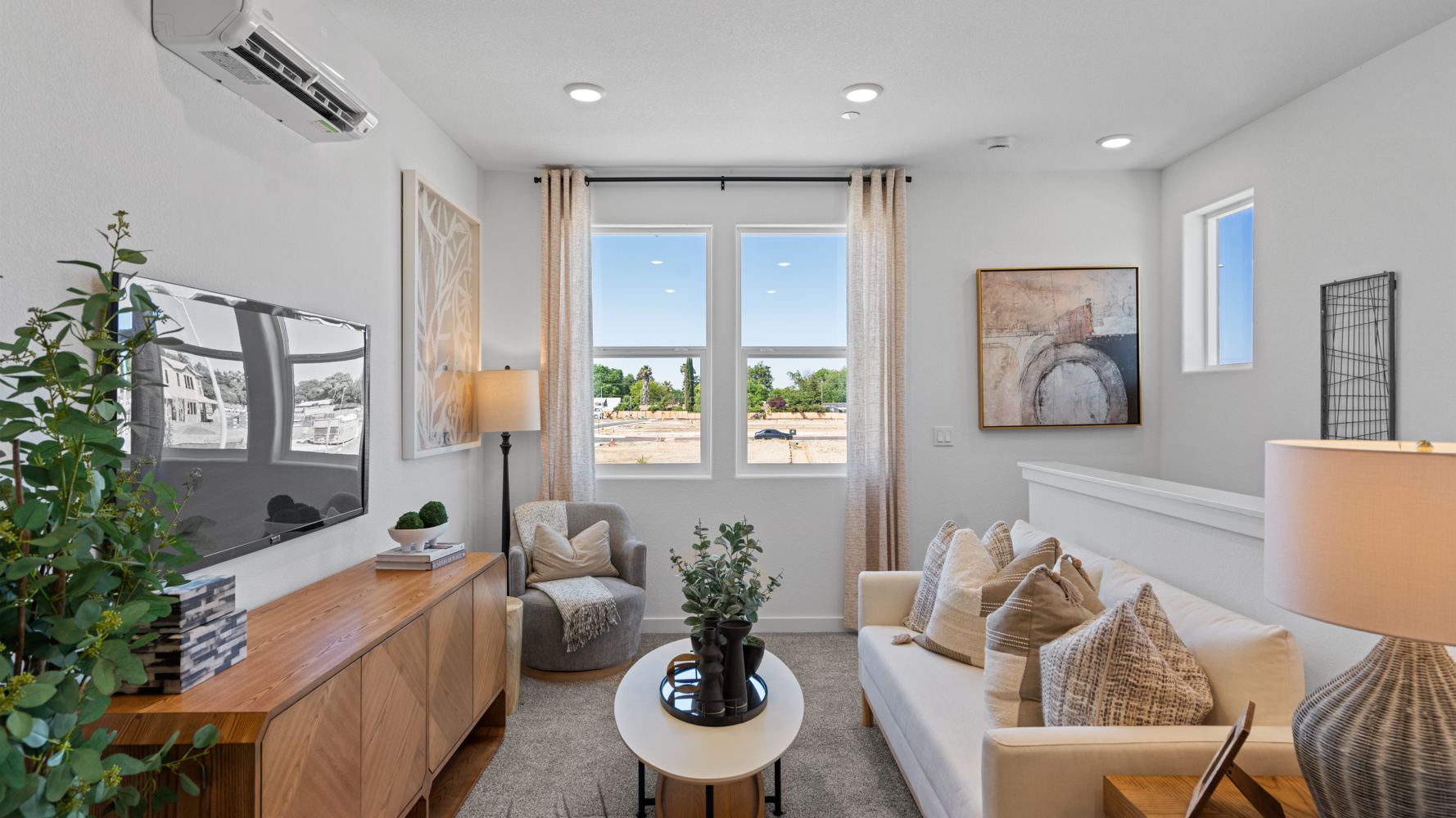 A living room with a tv and couches.
