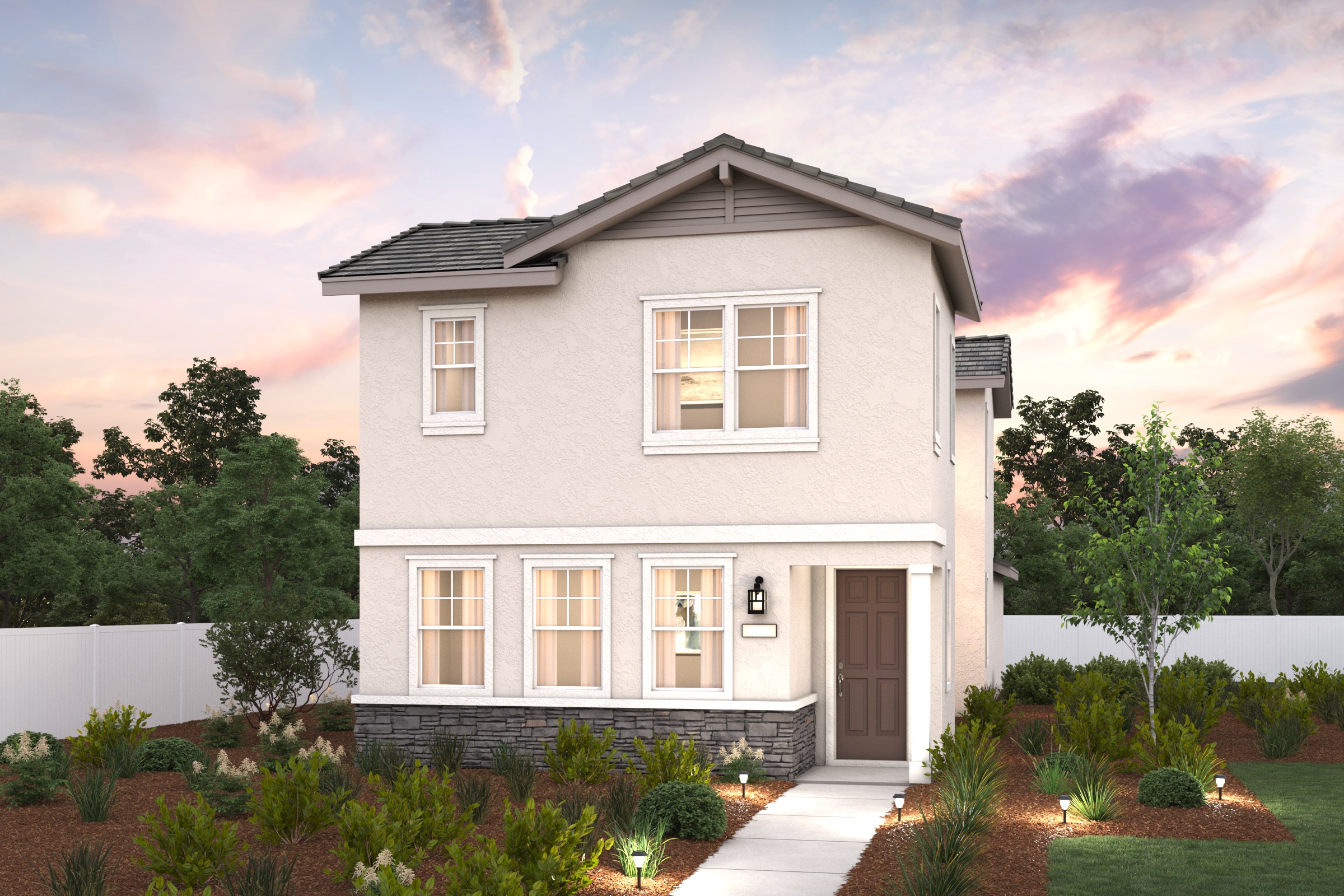 A house with a driveway and trees.