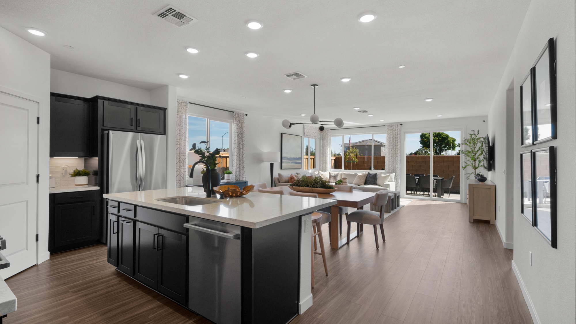 A kitchen with black cabinets.