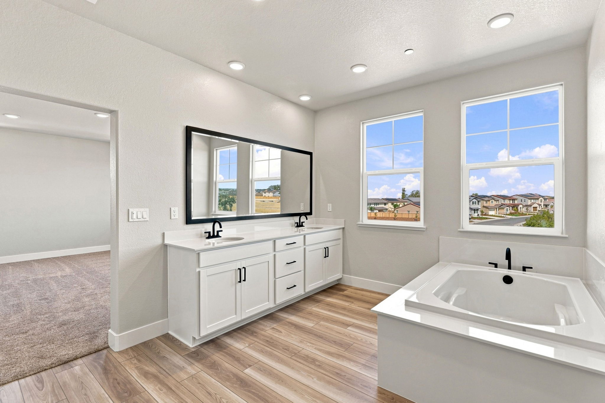 A bathroom with a tub and a sink.