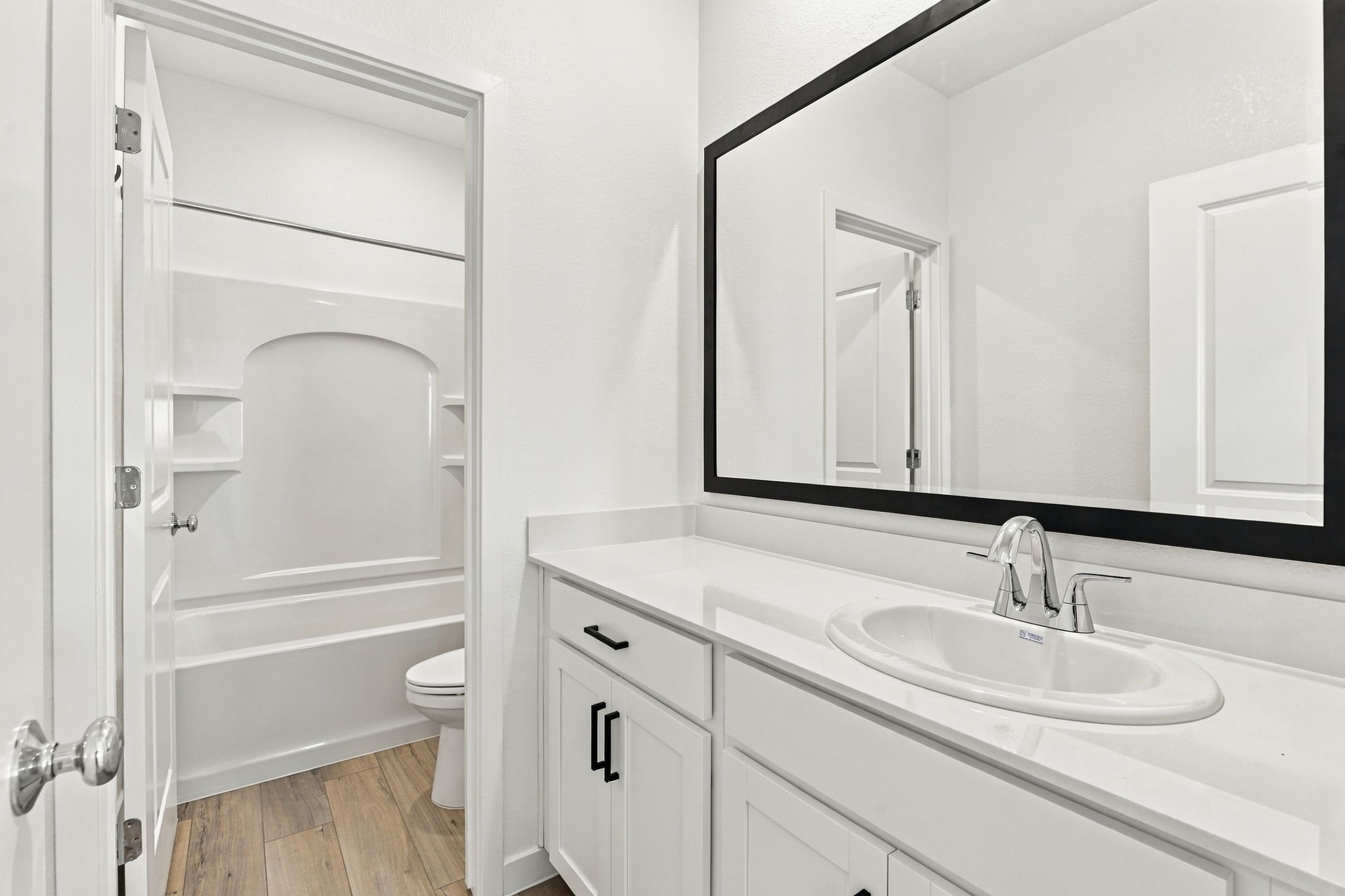 A bathroom with a sink and a toilet.