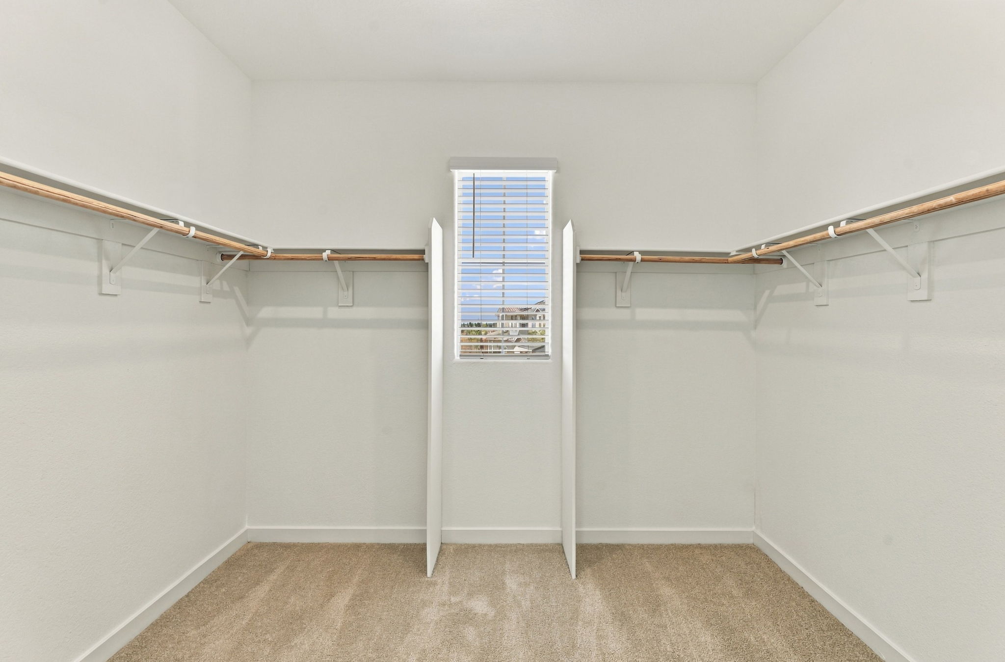 A white room with a window.