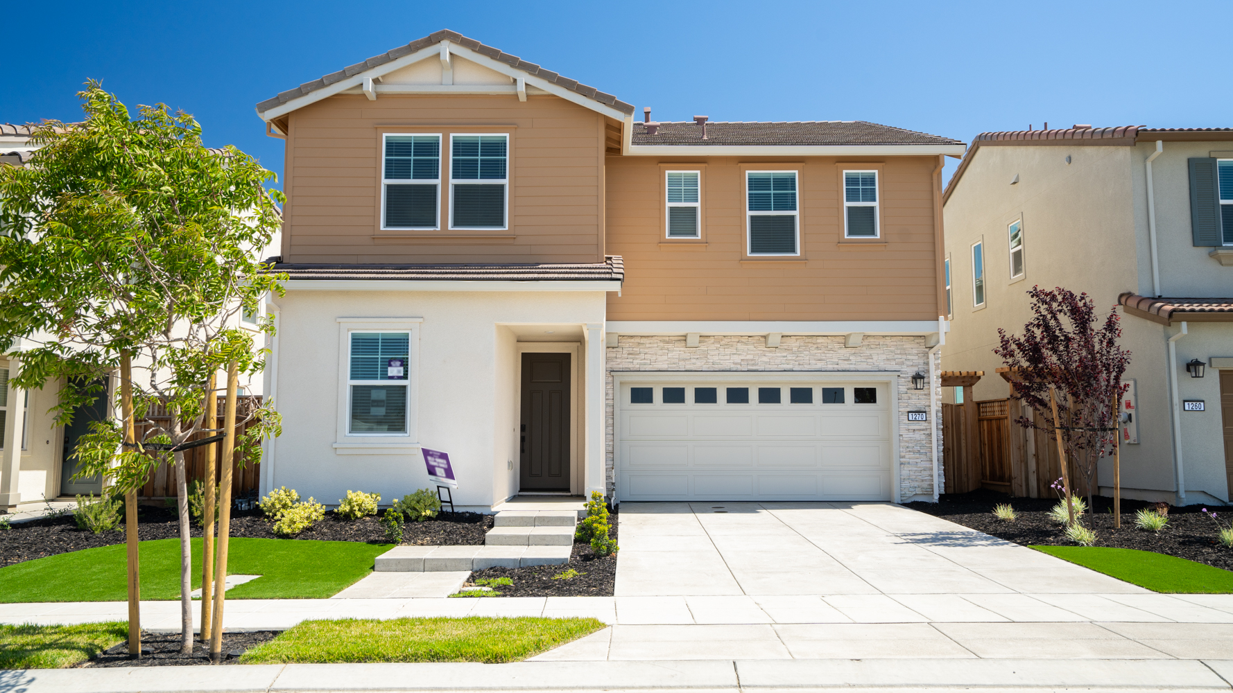 A large house with a driveway.
