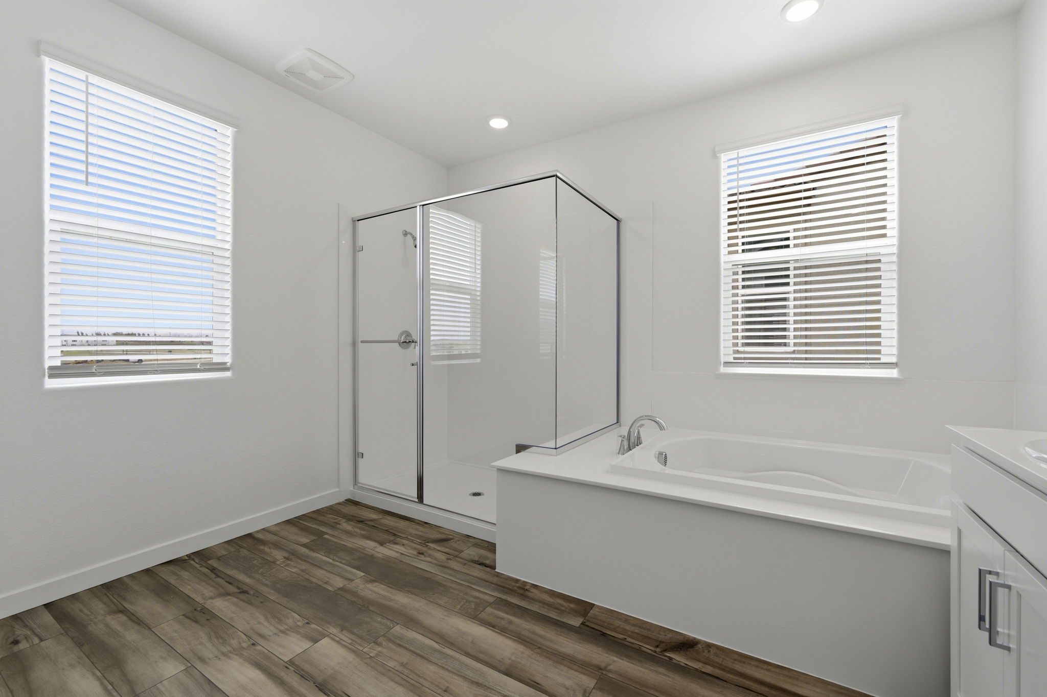 A bathroom with a tub and sink.