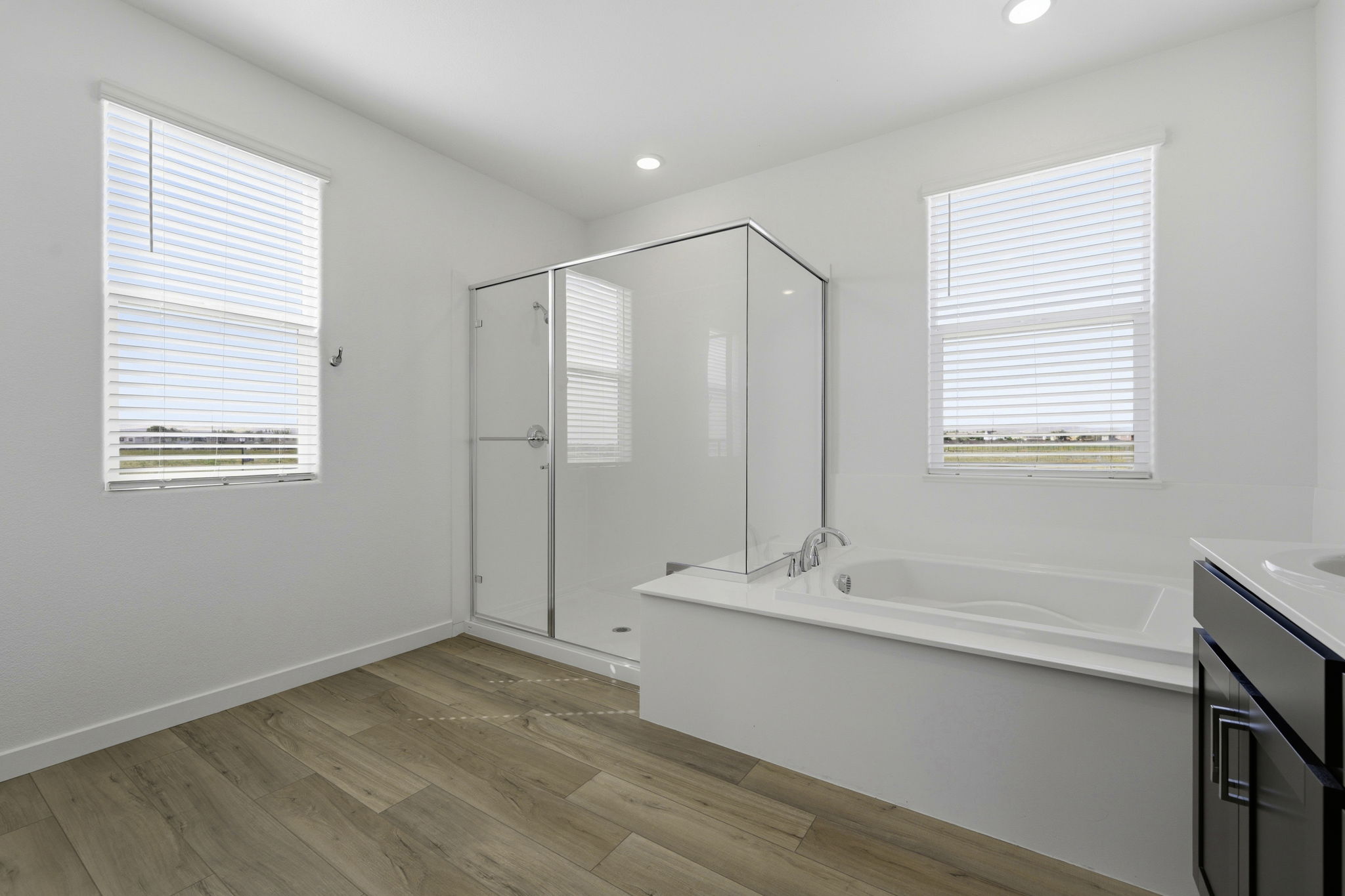 A bathroom with a tub and sink.