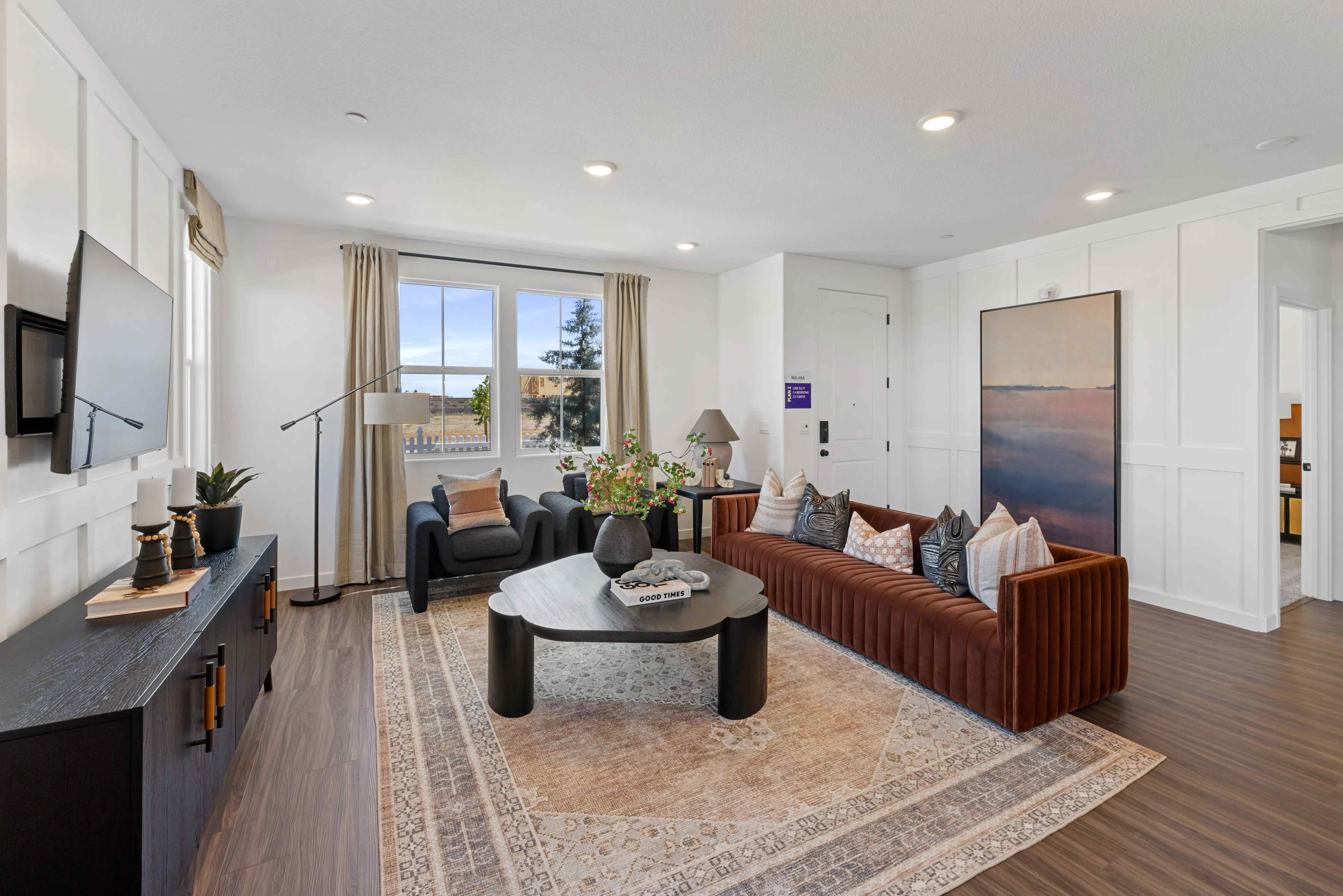 A living room with a large window.