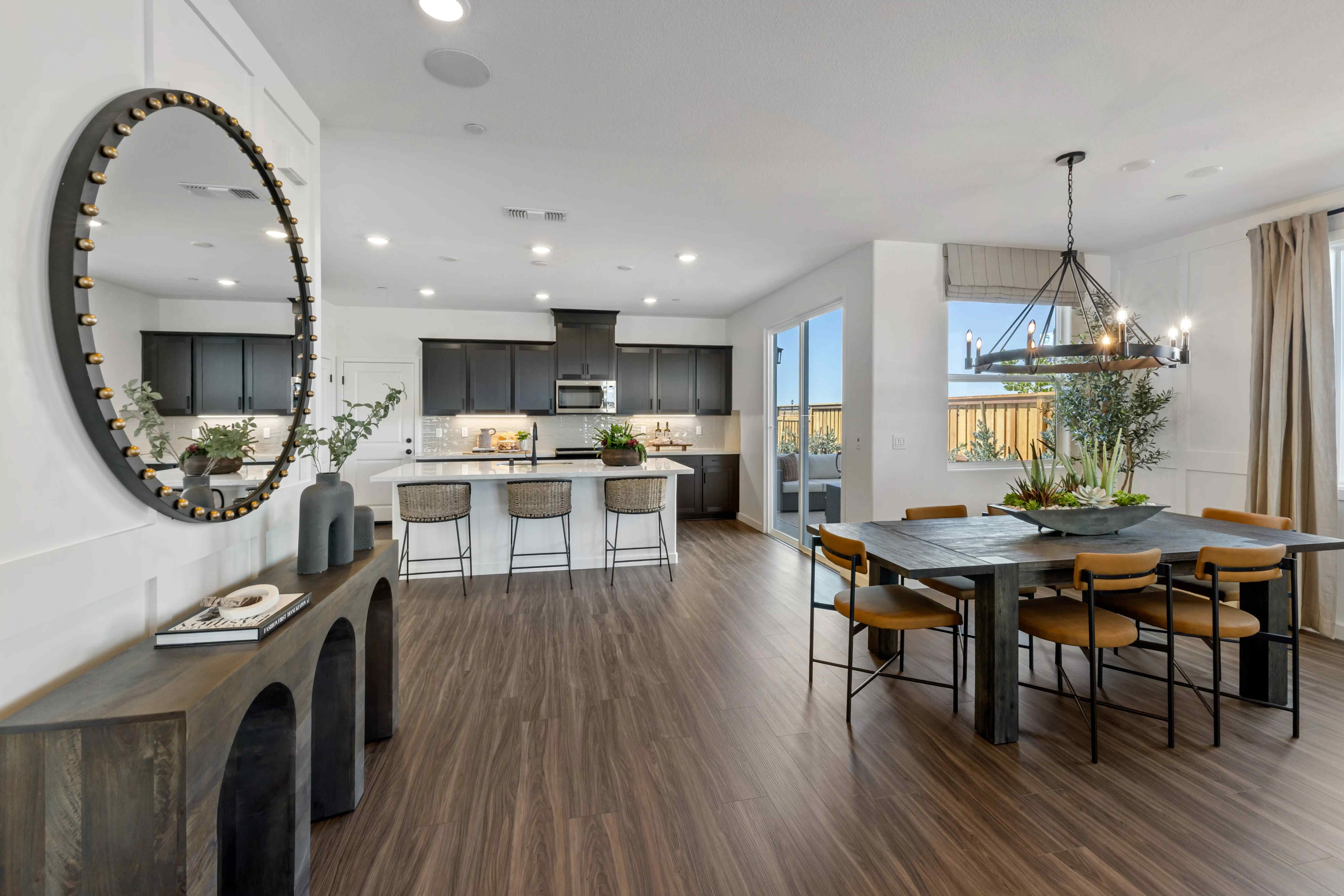 A large kitchen with a dining table.