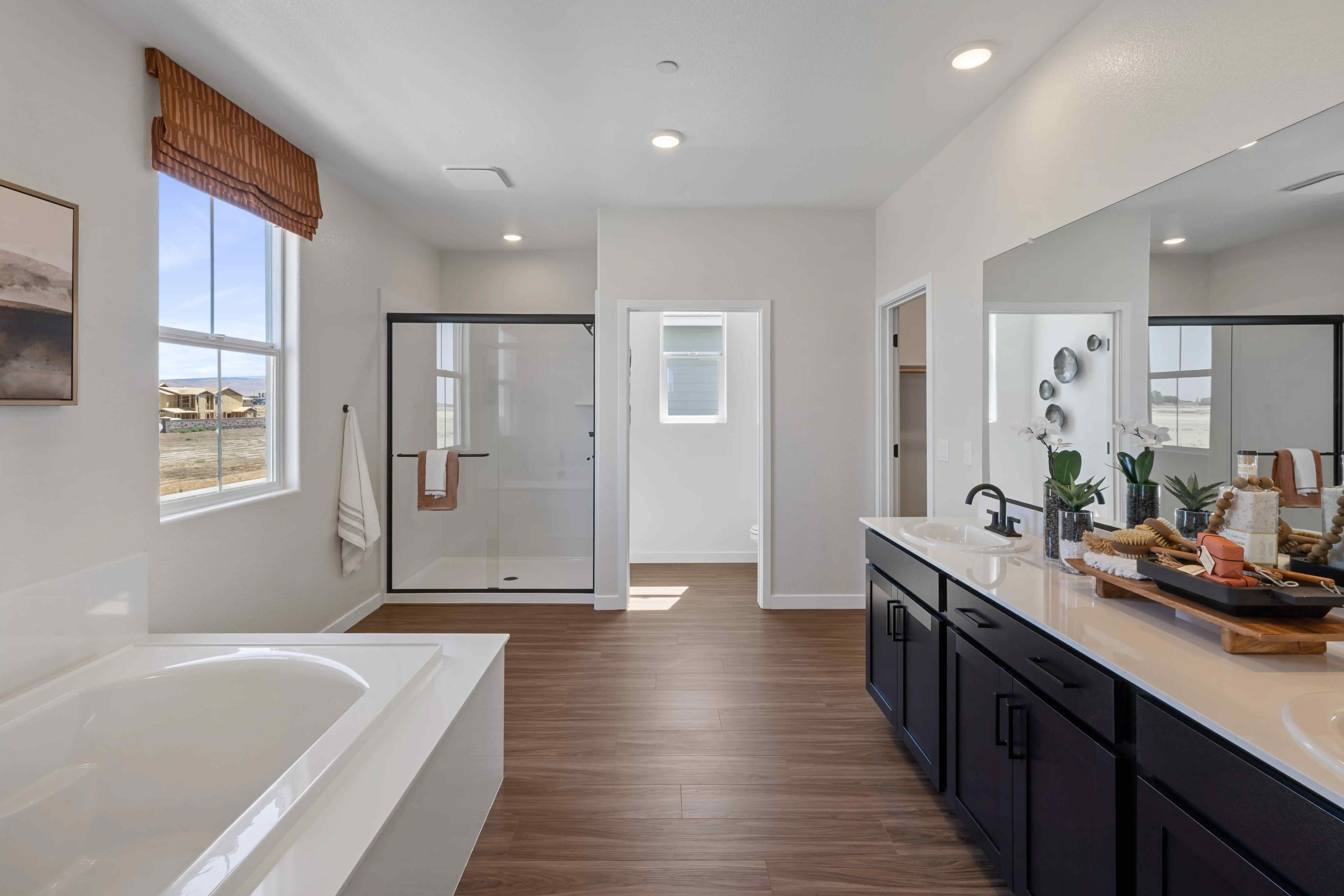 A bathroom with a tub sink and a bathtub.