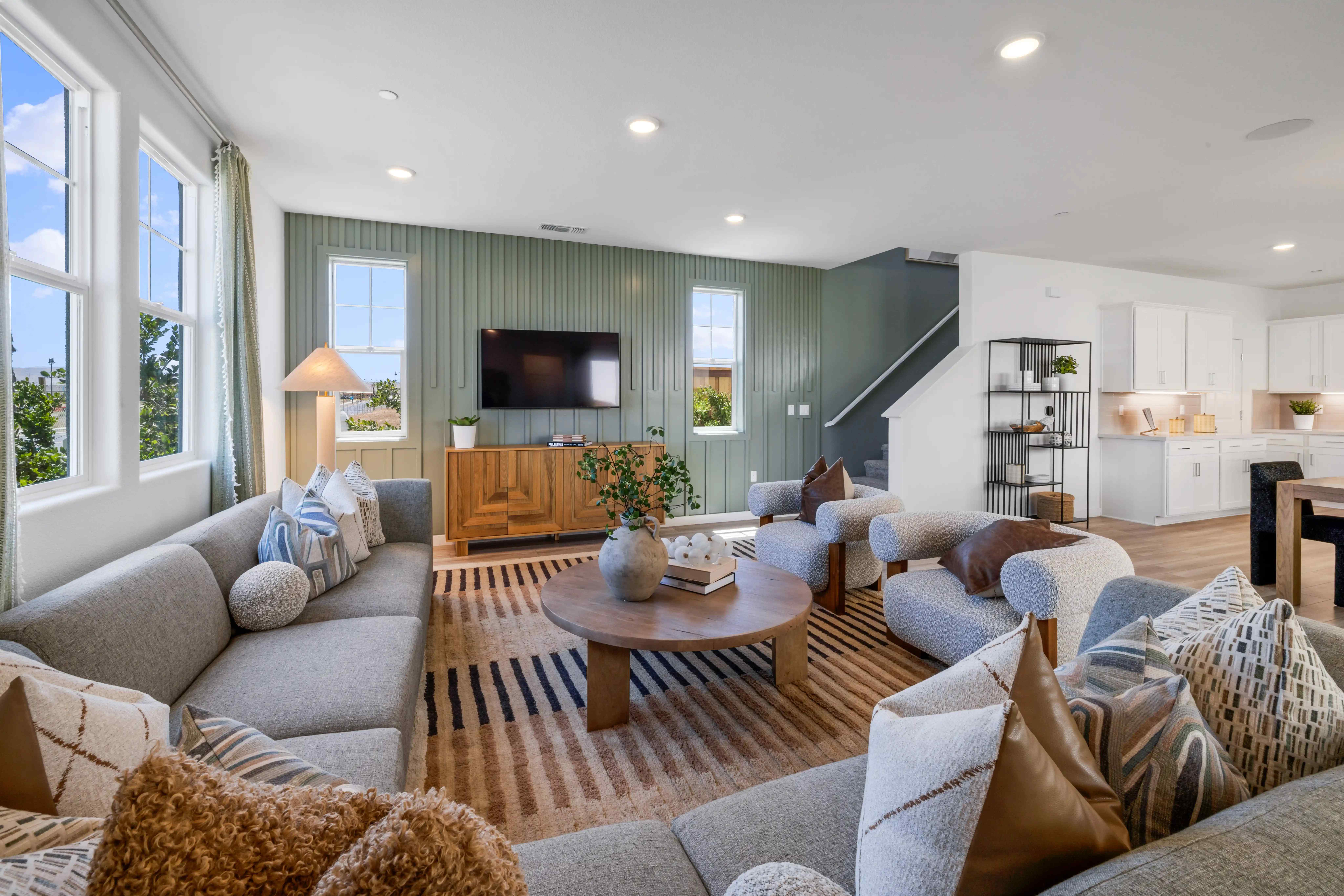 A living room with a large tv.