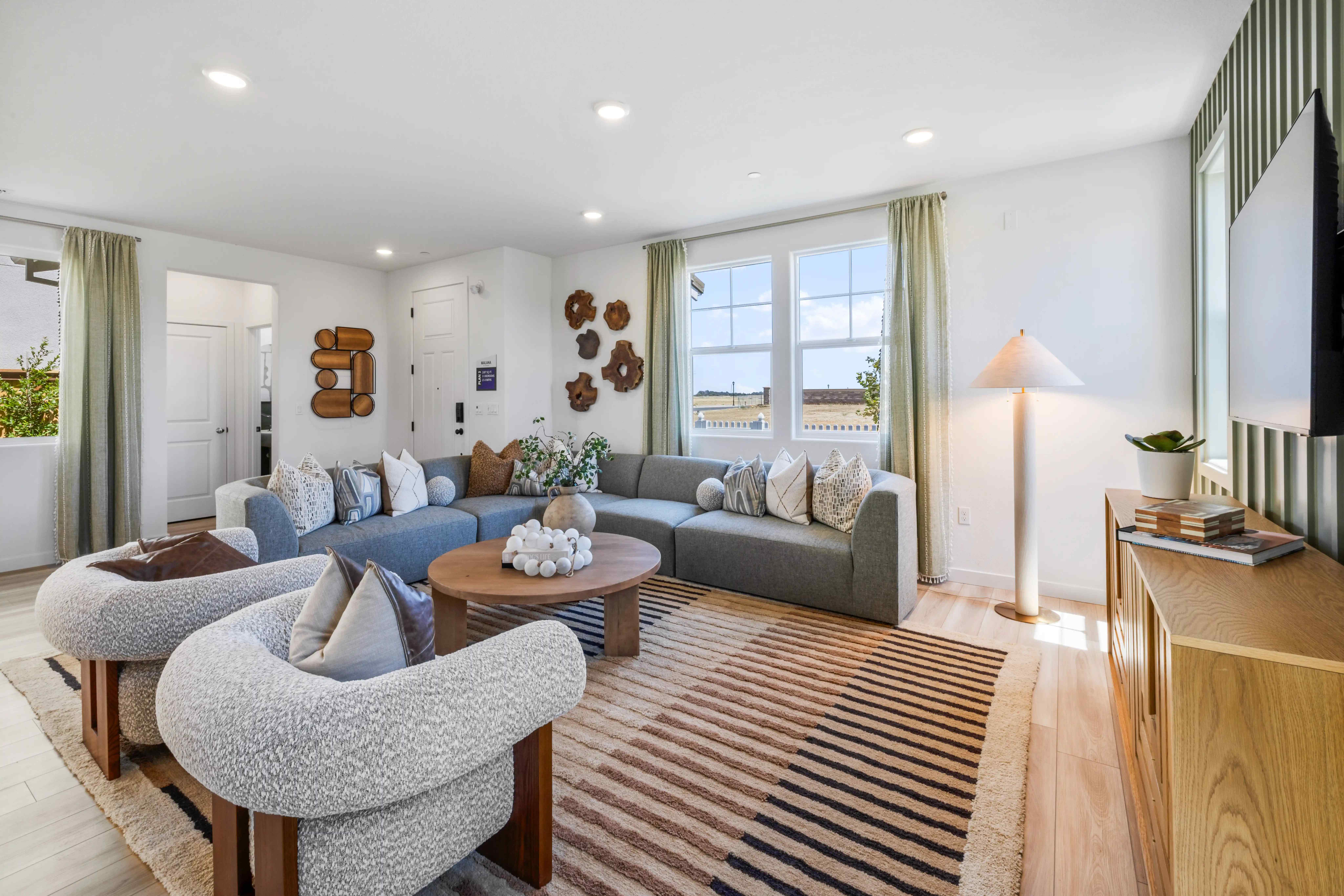 A living room with a couch and a table.