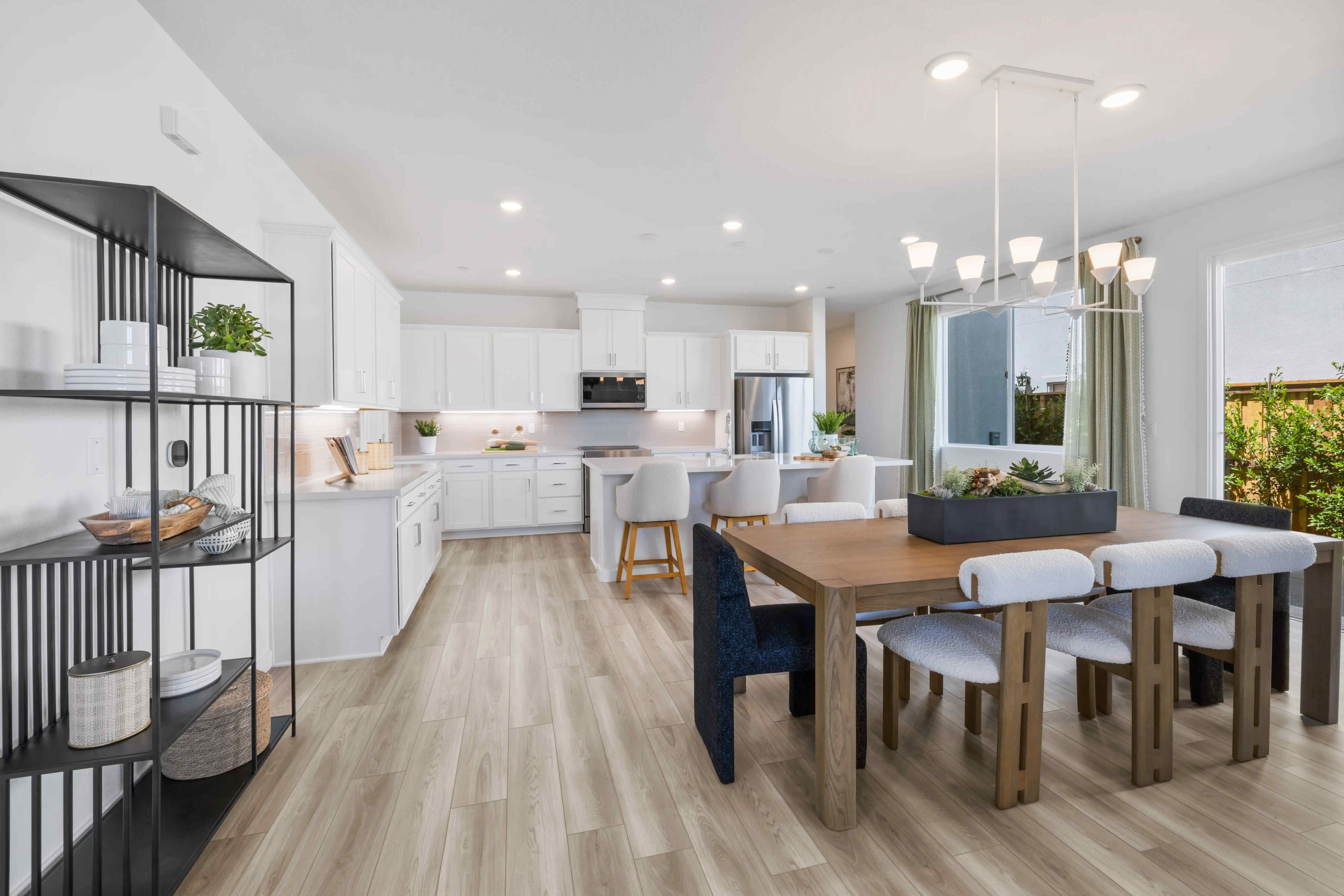 A kitchen with a wood floor.
