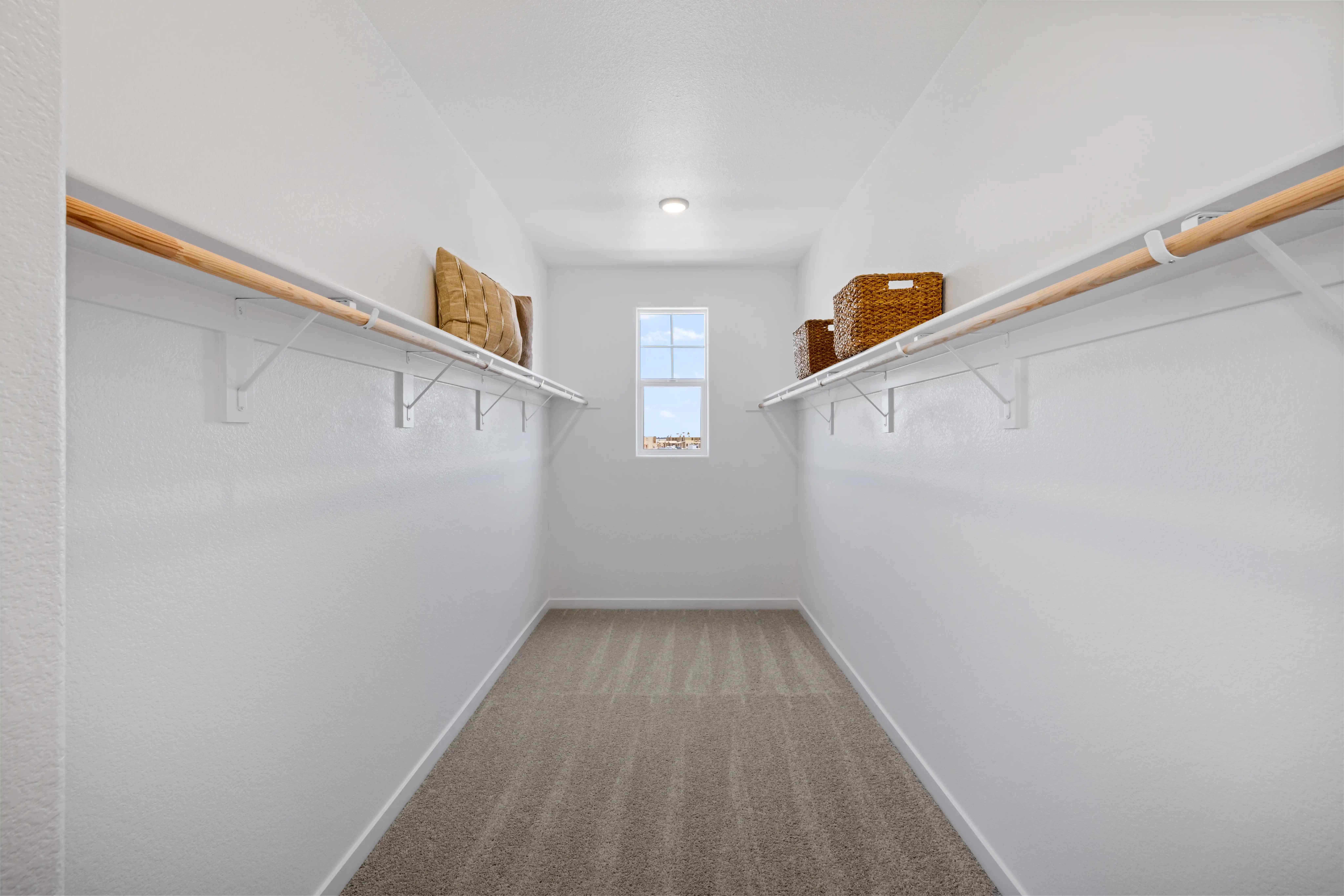 A hallway with a basket on the wall.