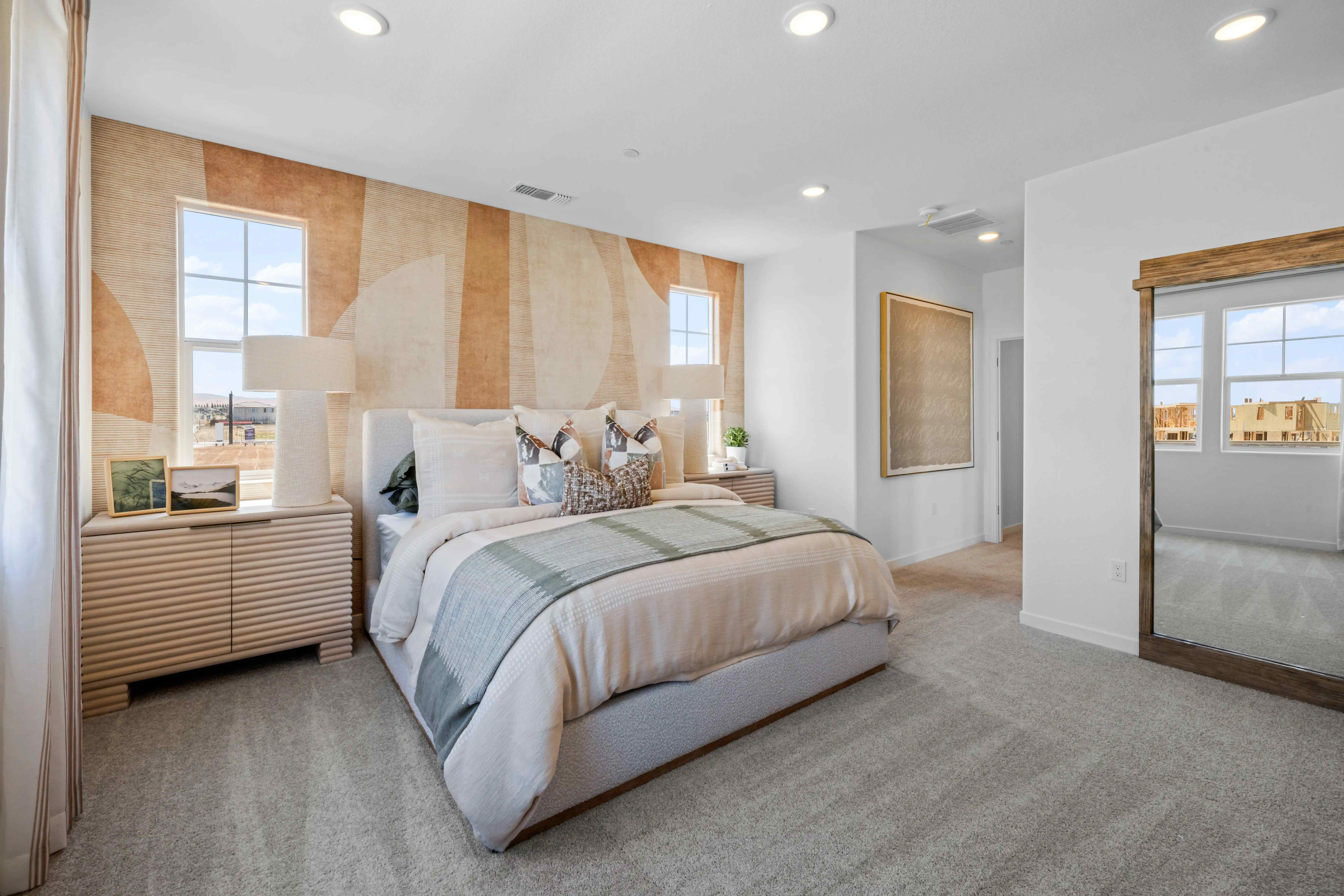 A bedroom with a large bed.