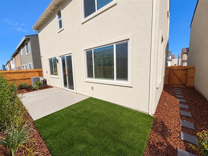 A house with a green lawn.