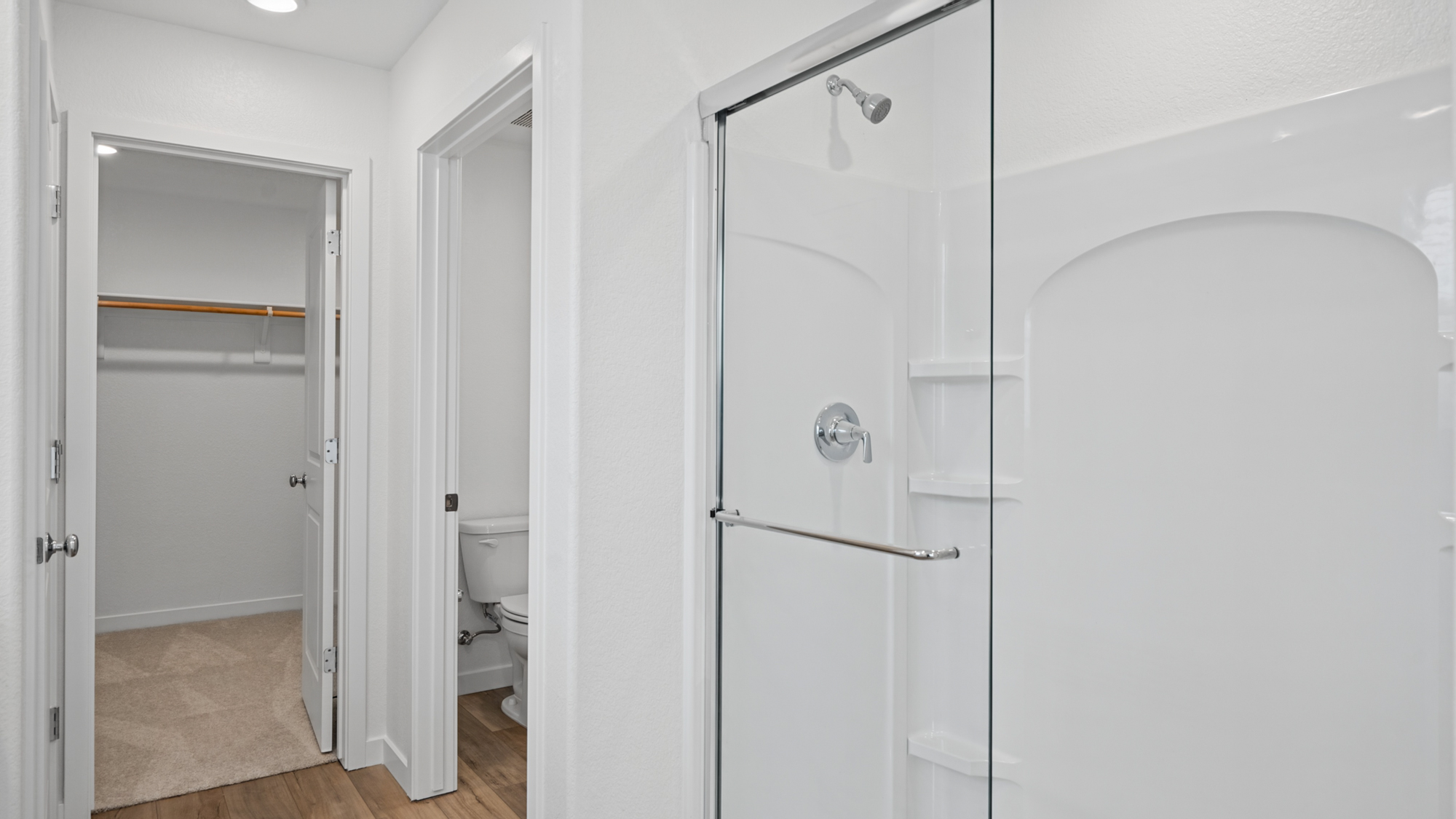 A bathroom with white doors.