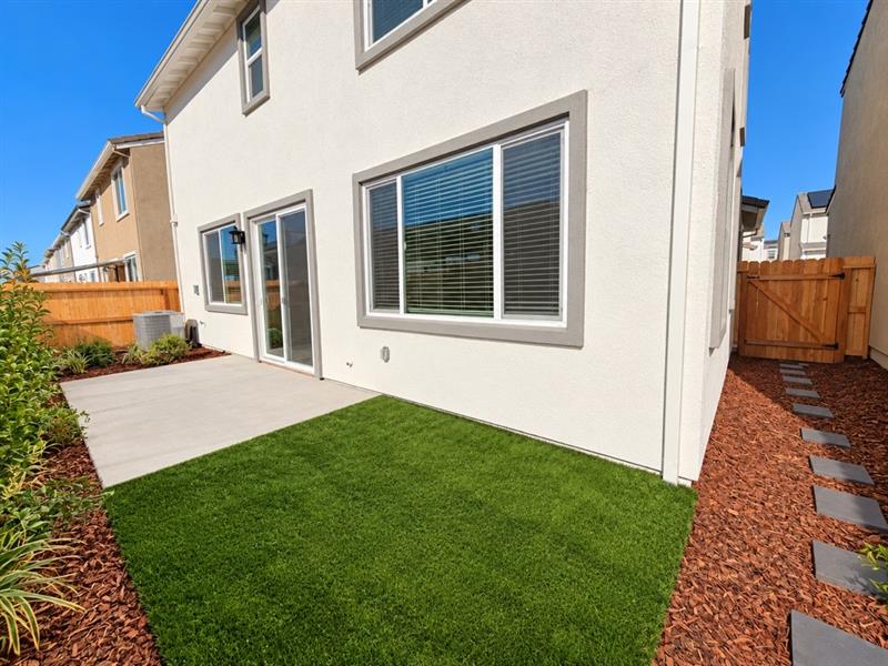 A house with a green lawn.