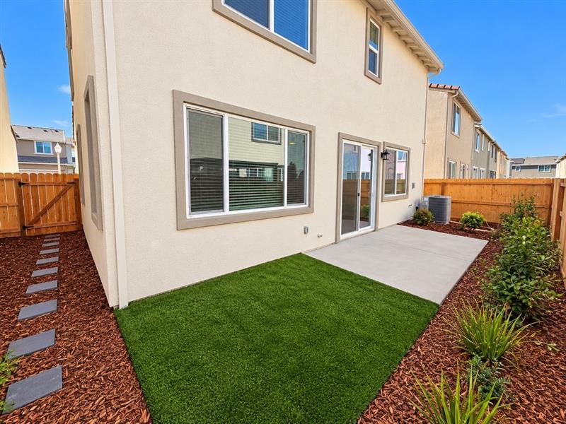 A house with a green lawn.