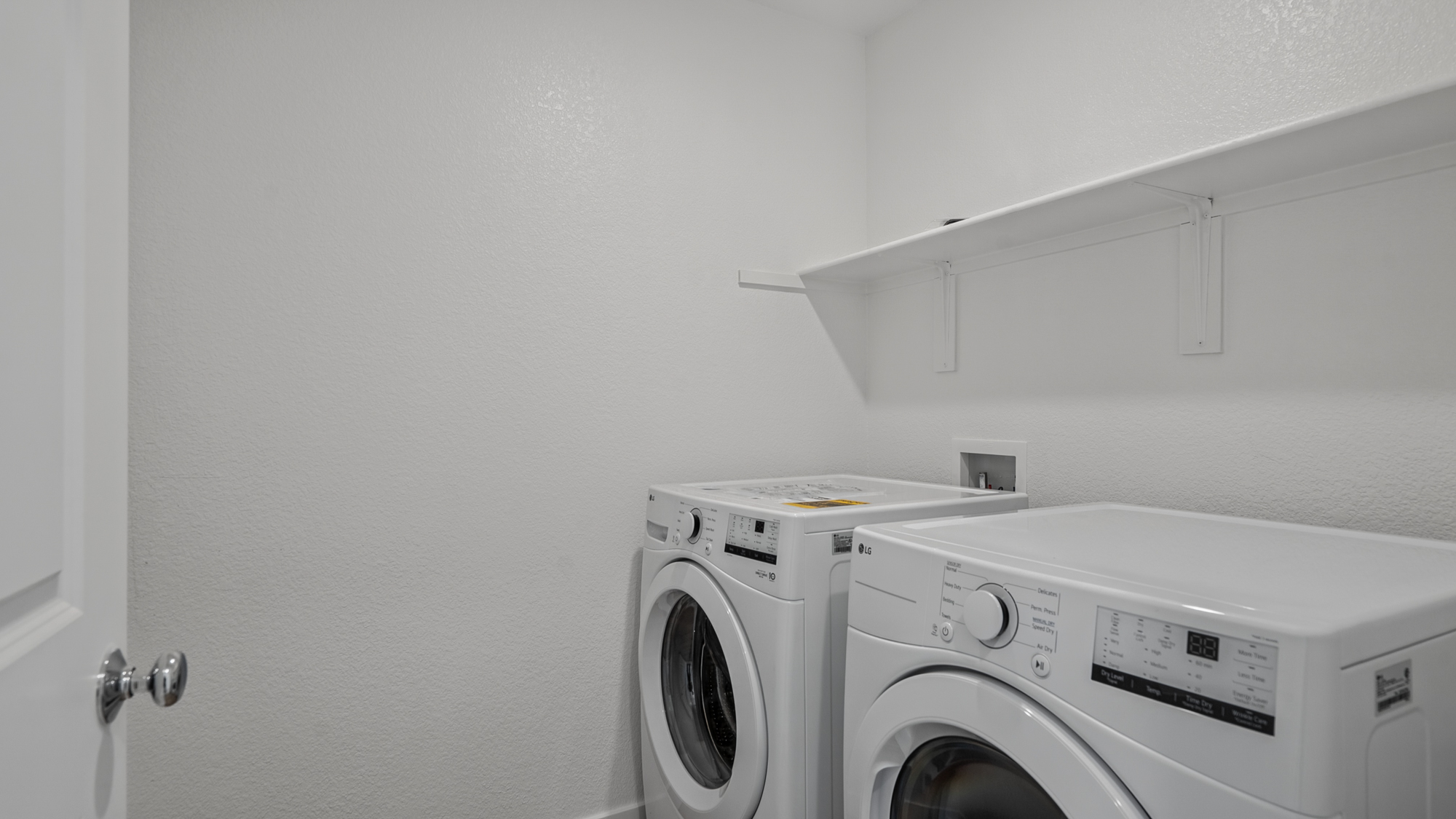 A white washing machine and dryer.