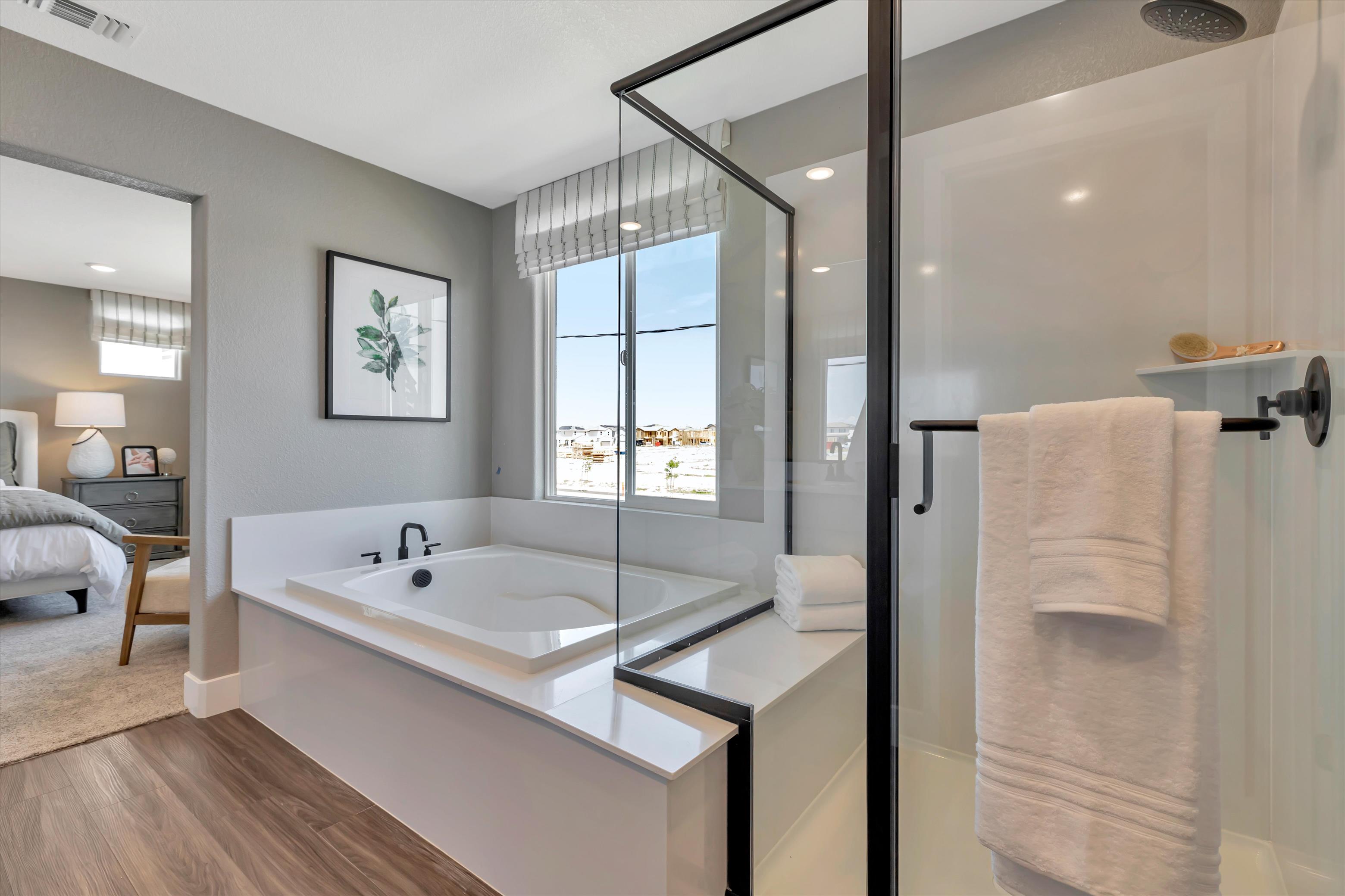 A bathroom with a tub and a sink.